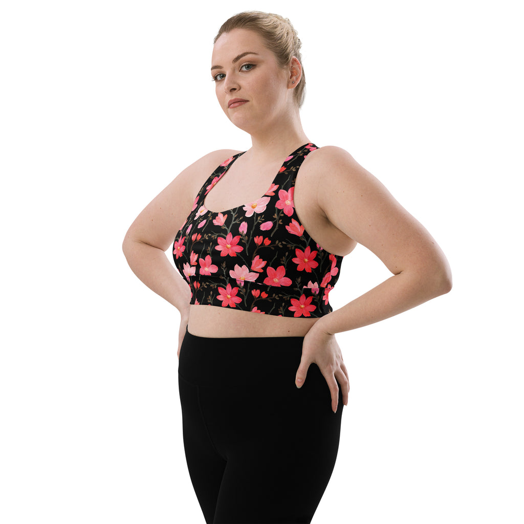 Women’s black sports bra with vibrant pink and red floral pattern buttery soft recycled fabric high intensity support