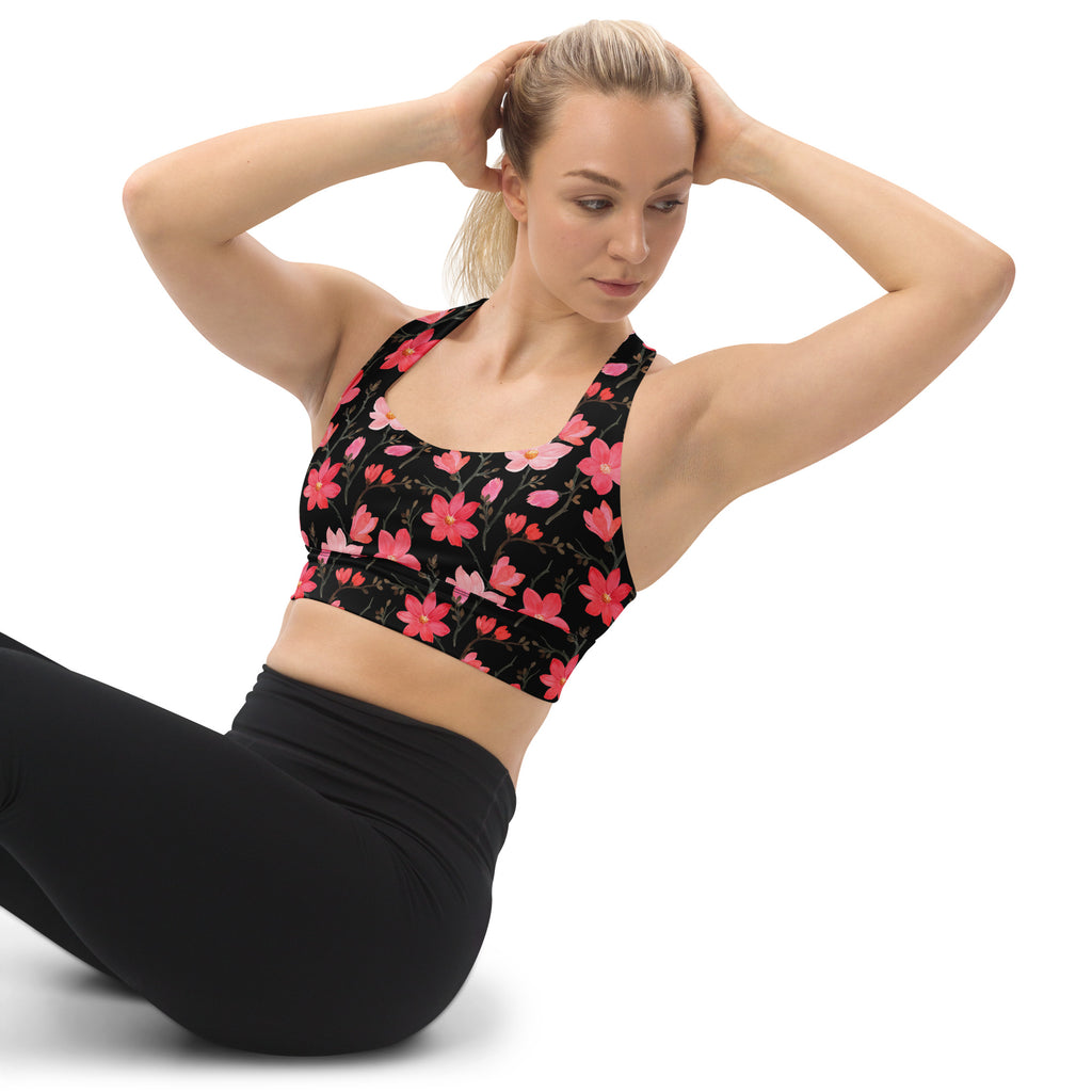 Women’s black sports bra with pink and red floral pattern high intensity support quick dry buttery soft recycled fabric