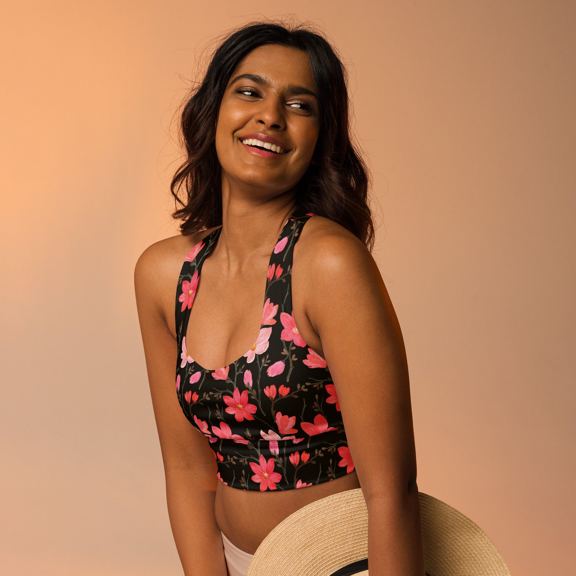 Women’s midnight floral buttery soft recycled black crop top sports bra with pink halter neck design for high intensity support
