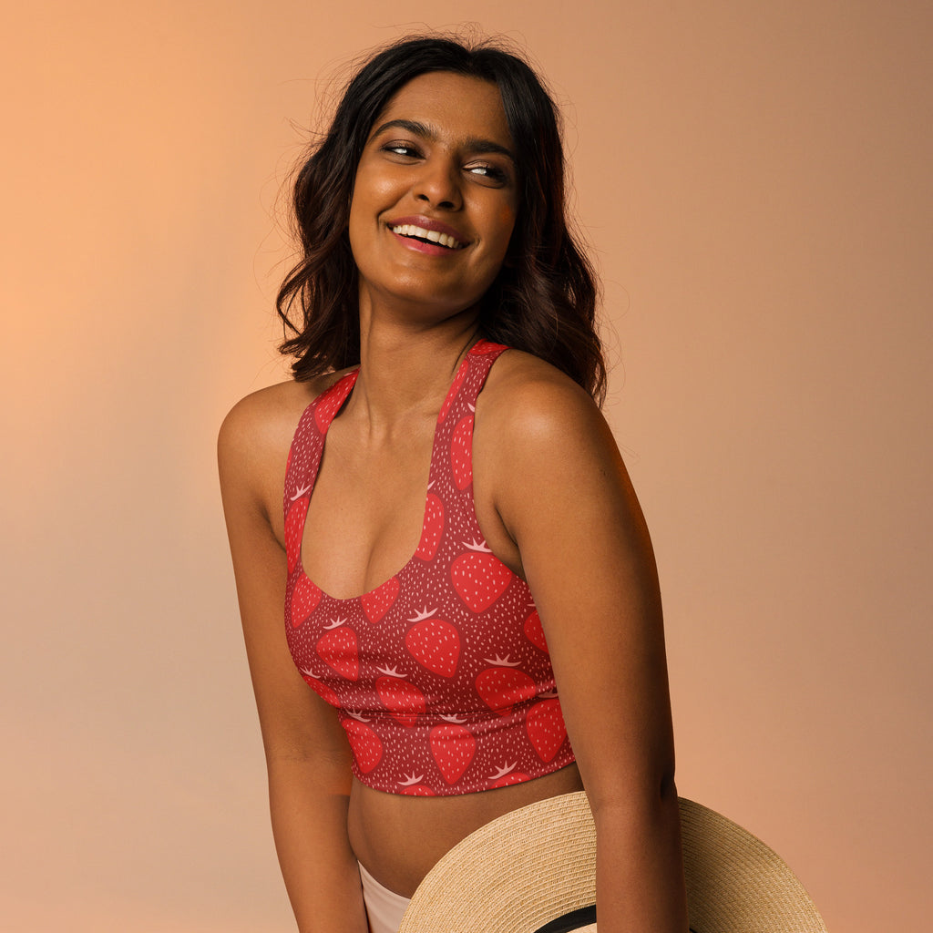 Women’s red strawberry-patterned crop top with halter neck and dotted texture made from buttery soft recycled fabric