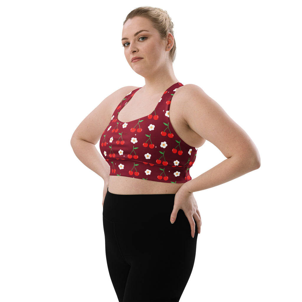 Red longline sports bra with cherry and white flower print made from buttery soft recycled fabric for high intensity support
