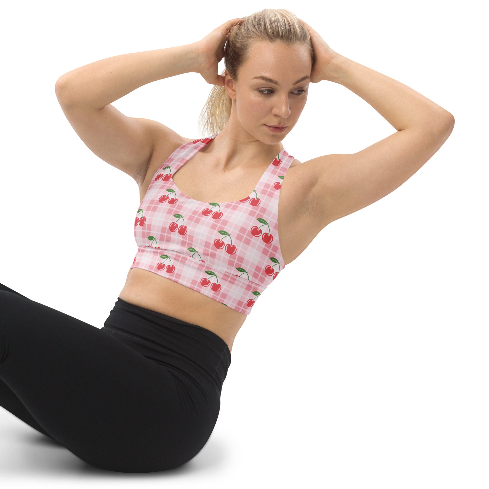Women’s pink and white checkered recycled longline sports bra with red cherry graphics high intensity support