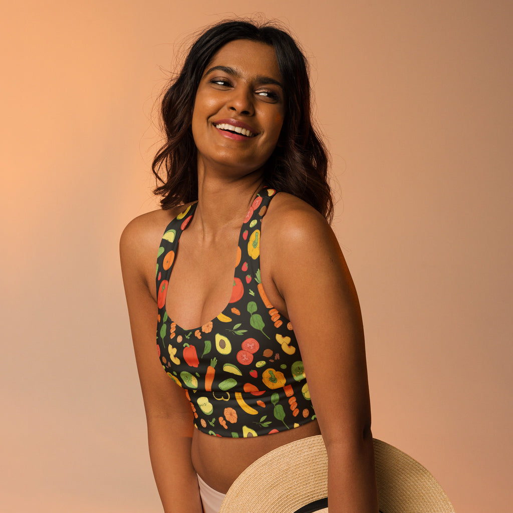 Women’s black halter longline sports bra with colorful veggie print made of buttery soft recycled fabric for high support