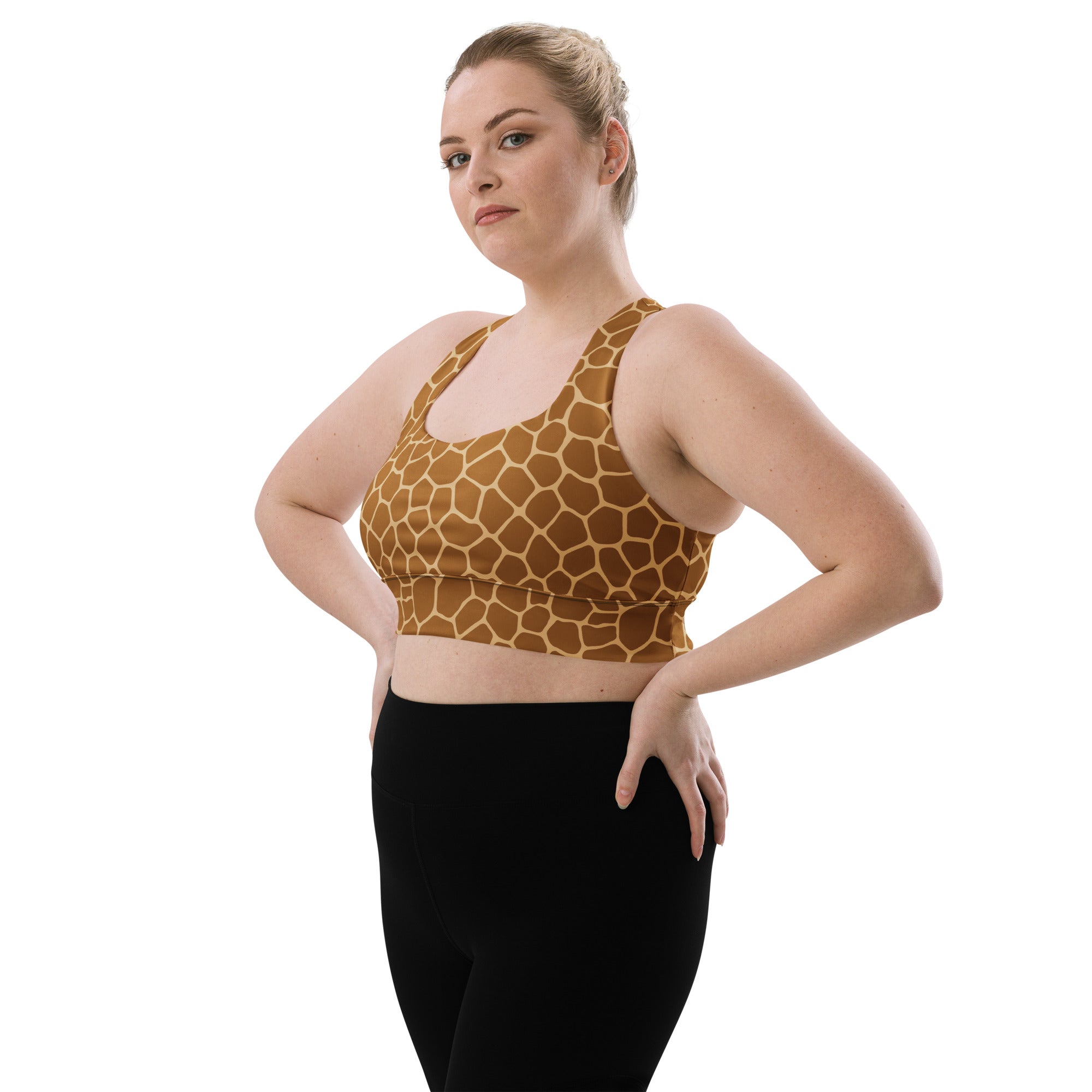 Women’s plus-size longline sports bra with brown and tan giraffe print made from buttery soft recycled fabric