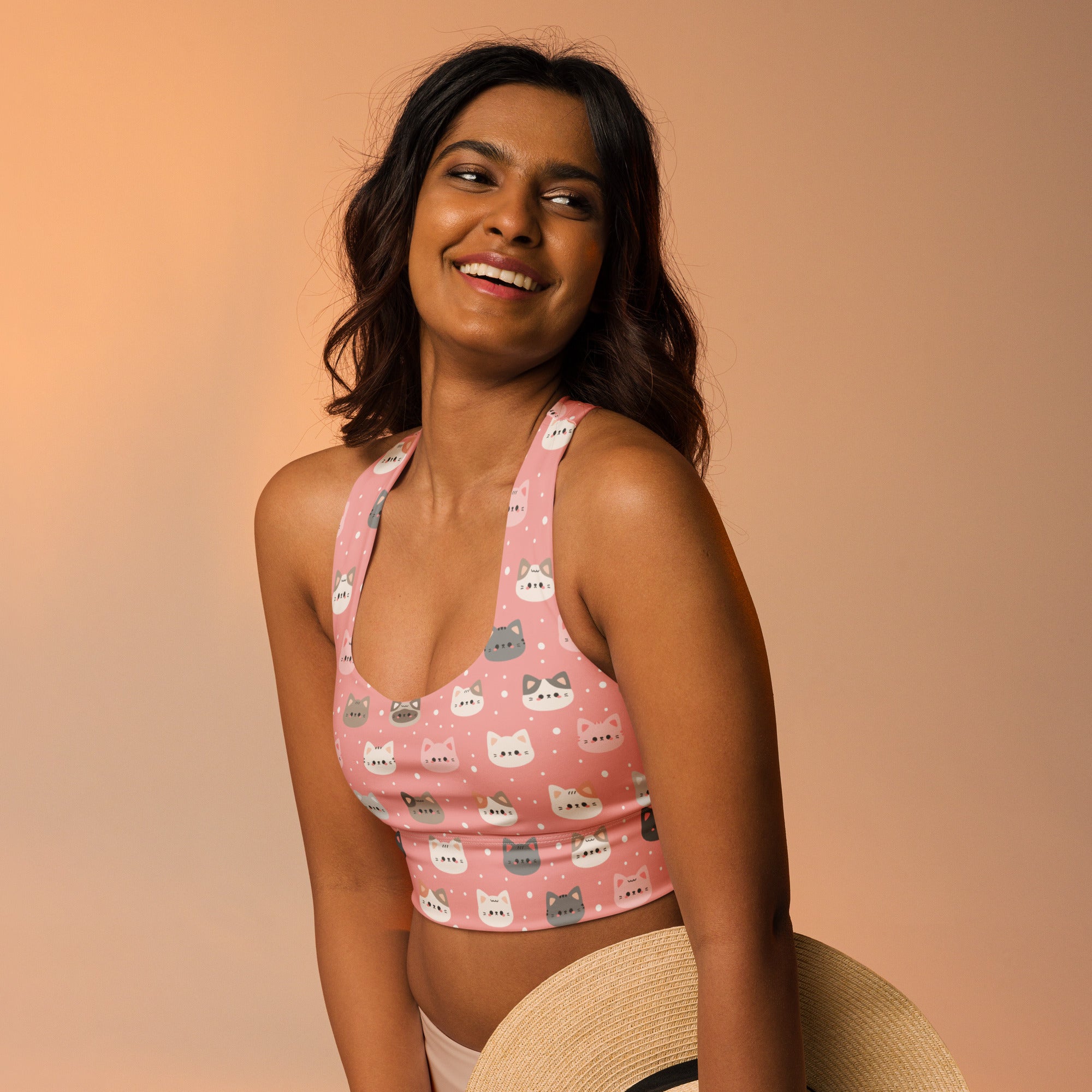 Women’s cute pink longline sports bra with white and gray cat faces buttery soft recycled fabric high intensity support