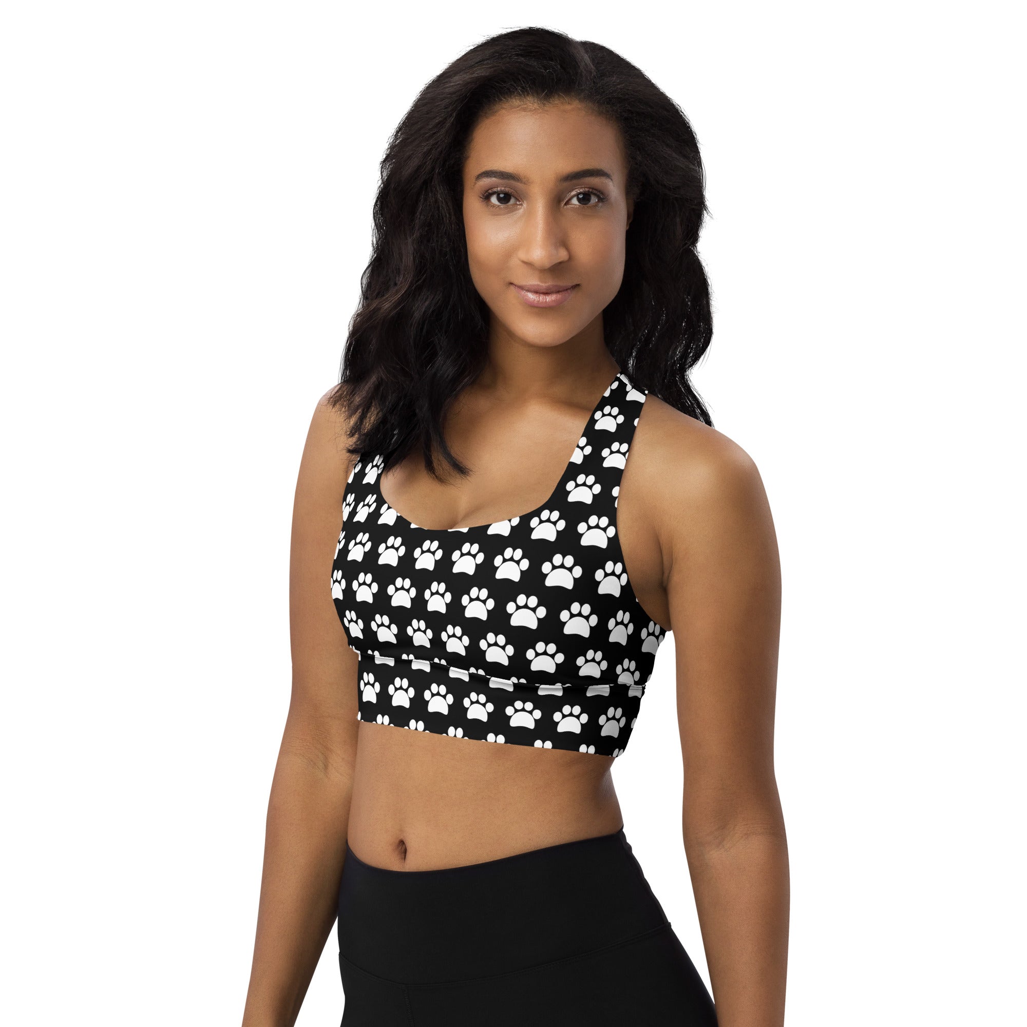 Women’s black and white paw print longline sports bra made from buttery soft recycled fabric with high intensity support