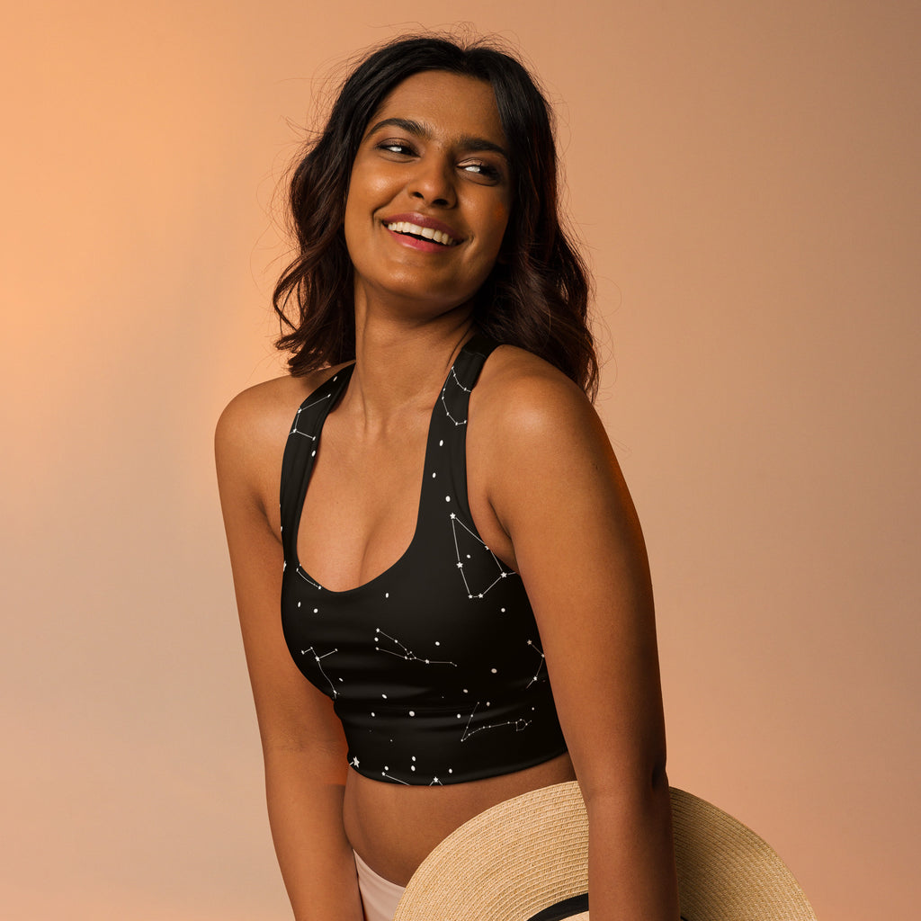 Black longline sports bra with white constellation patterns made from buttery soft recycled fabric for high intensity support