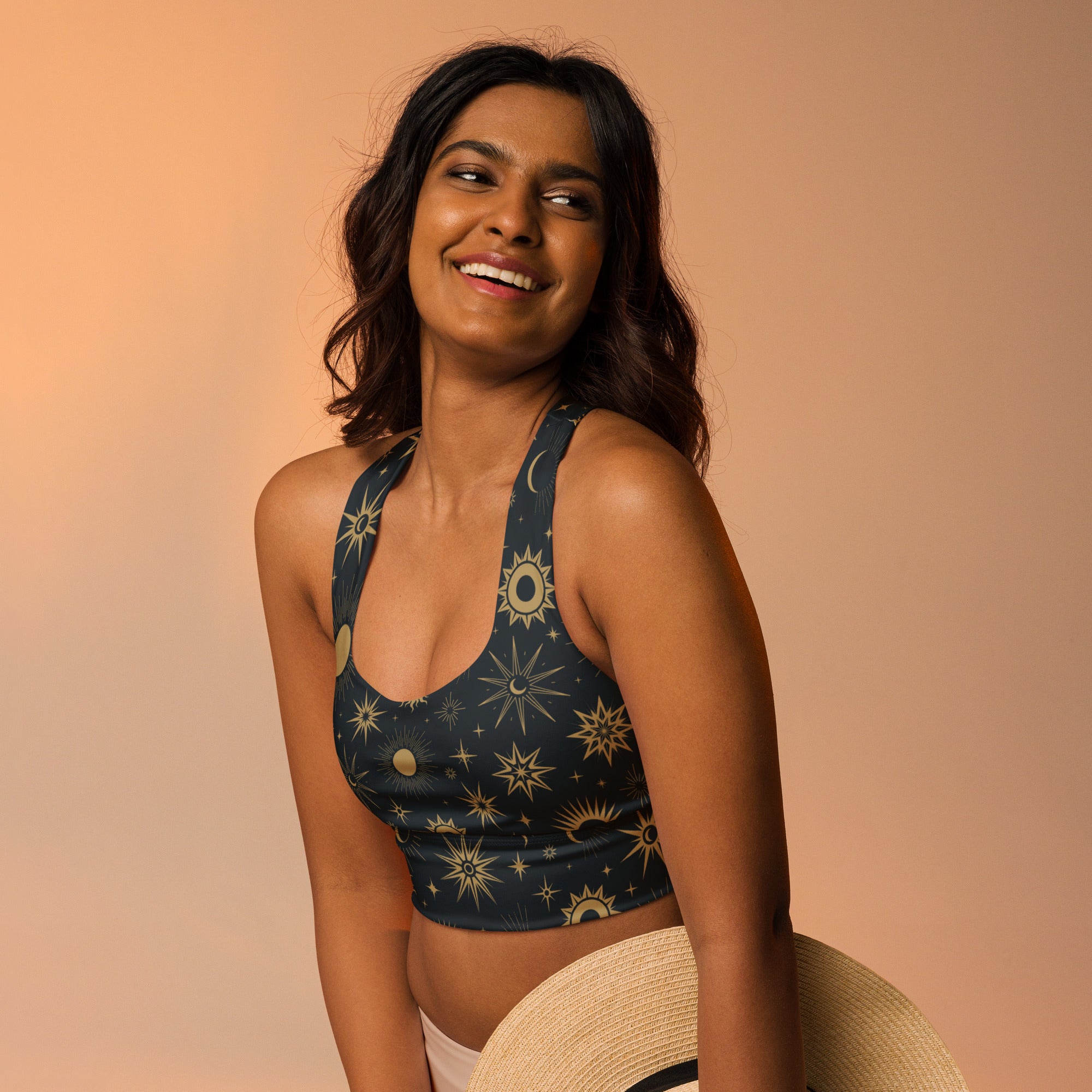Dark blue recycled longline sports bra with gold celestial sun moon stars pattern buttery soft quick dry upf 50+