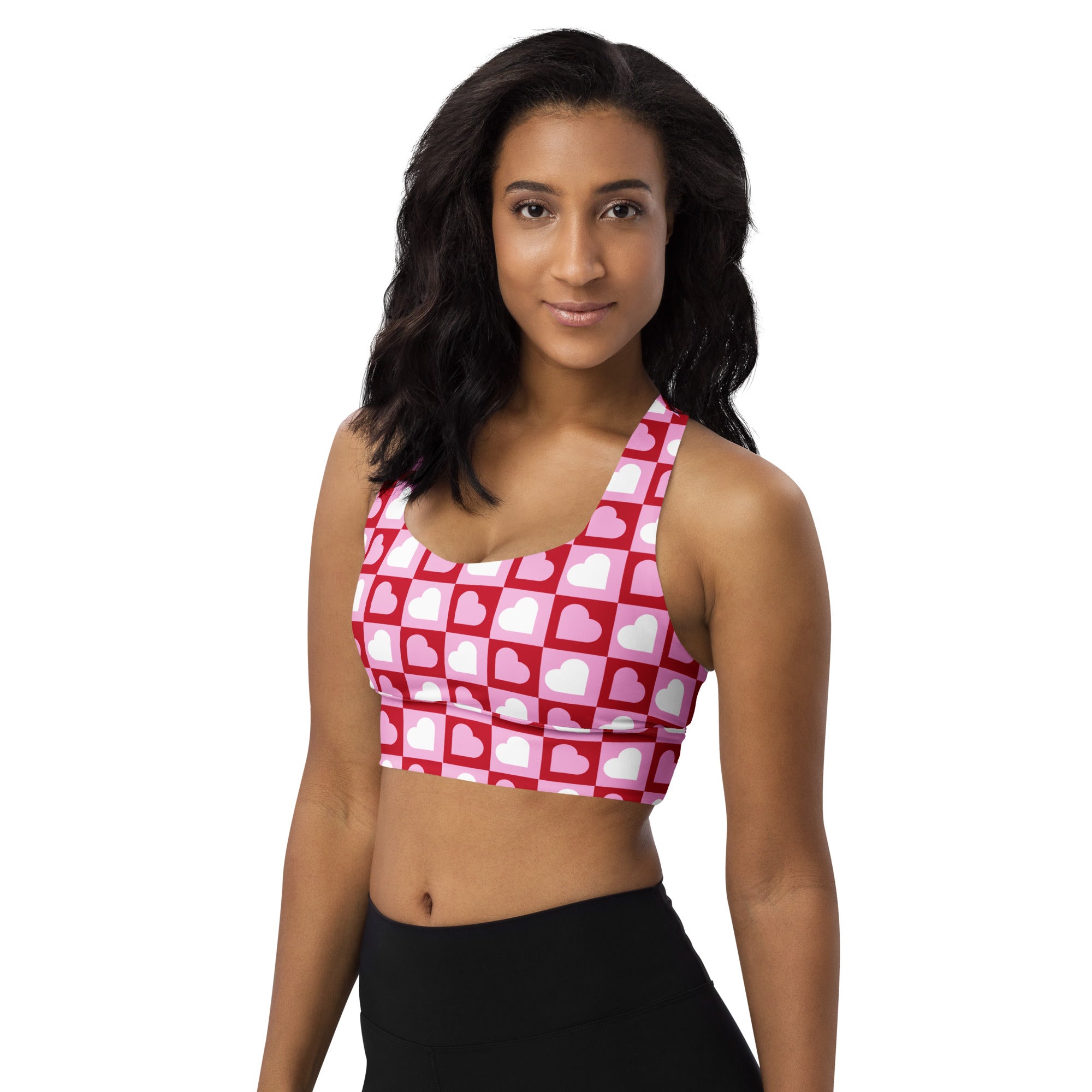 Women’s pink and white heart print buttery soft recycled longline sports bra with checkered design for high intensity support