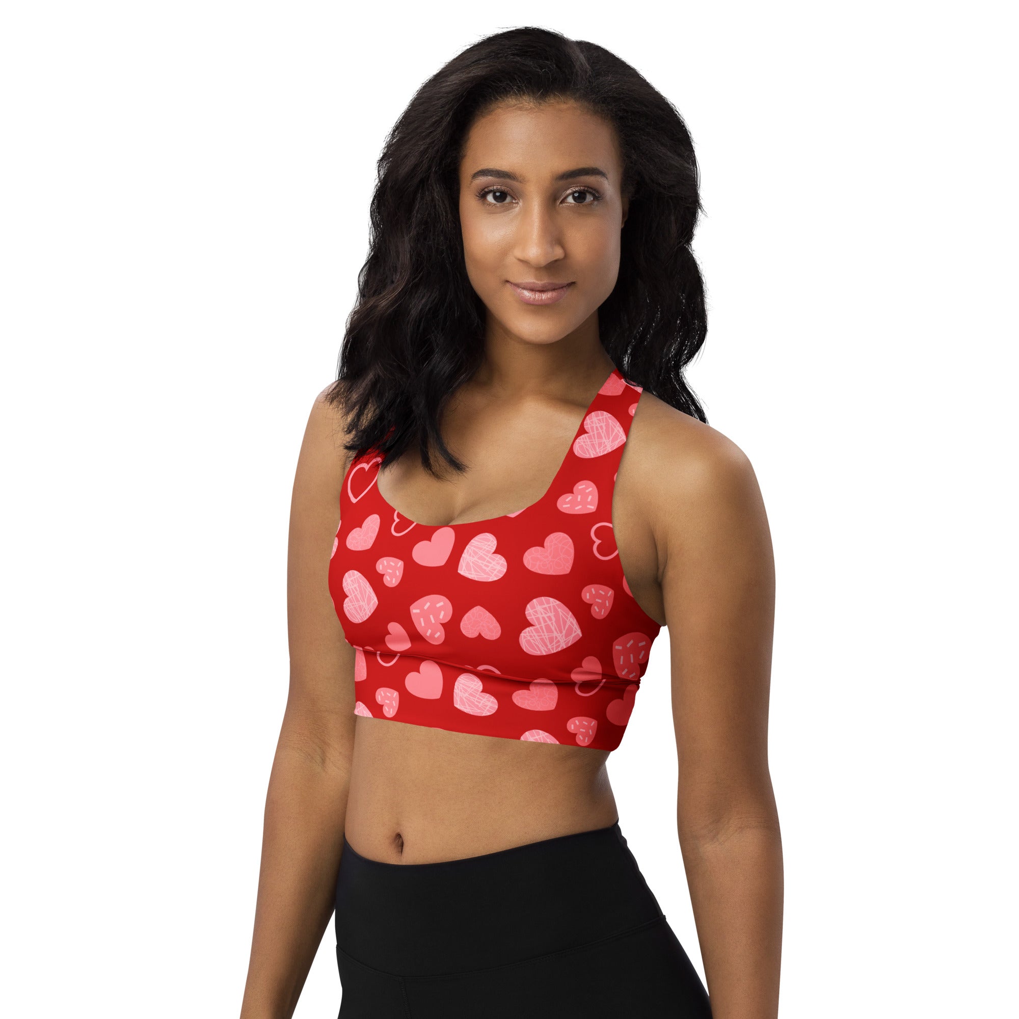 Women’s red longline sports bra with pink heart pattern buttery soft recycled fabric high intensity support
