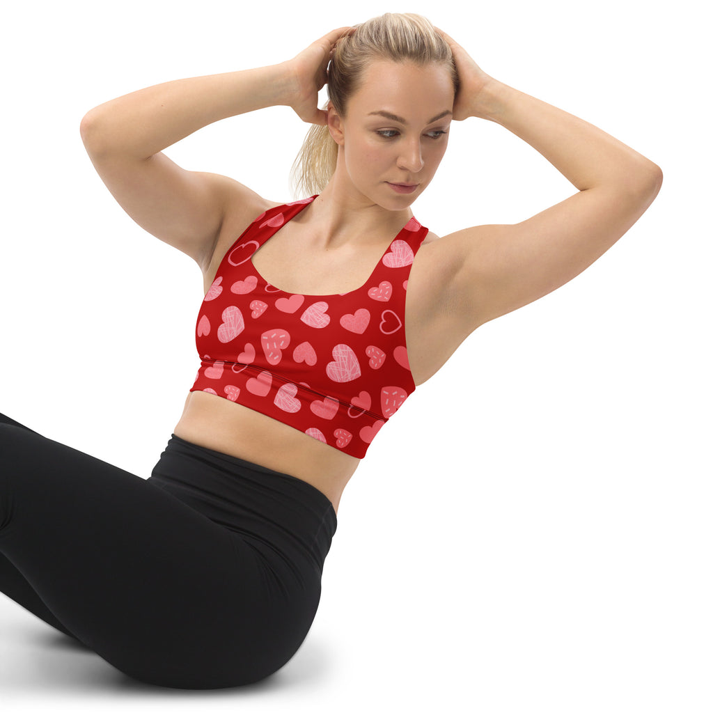 Women’s red longline sports bra with pink and white heart pattern buttery soft recycled fabric high intensity support