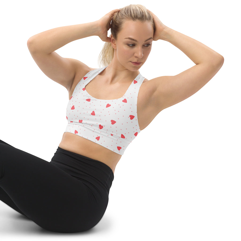 Women’s white sports bra with red heart and dot pattern buttery soft recycled fabric high intensity support