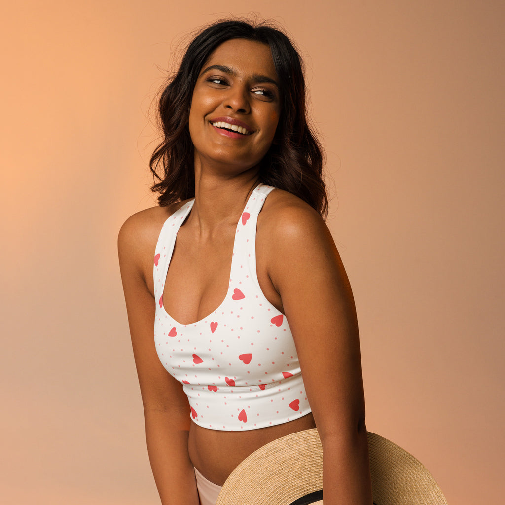 White crop top sports bra with pink heart and dot pattern buttery soft recycled fabric high intensity support
