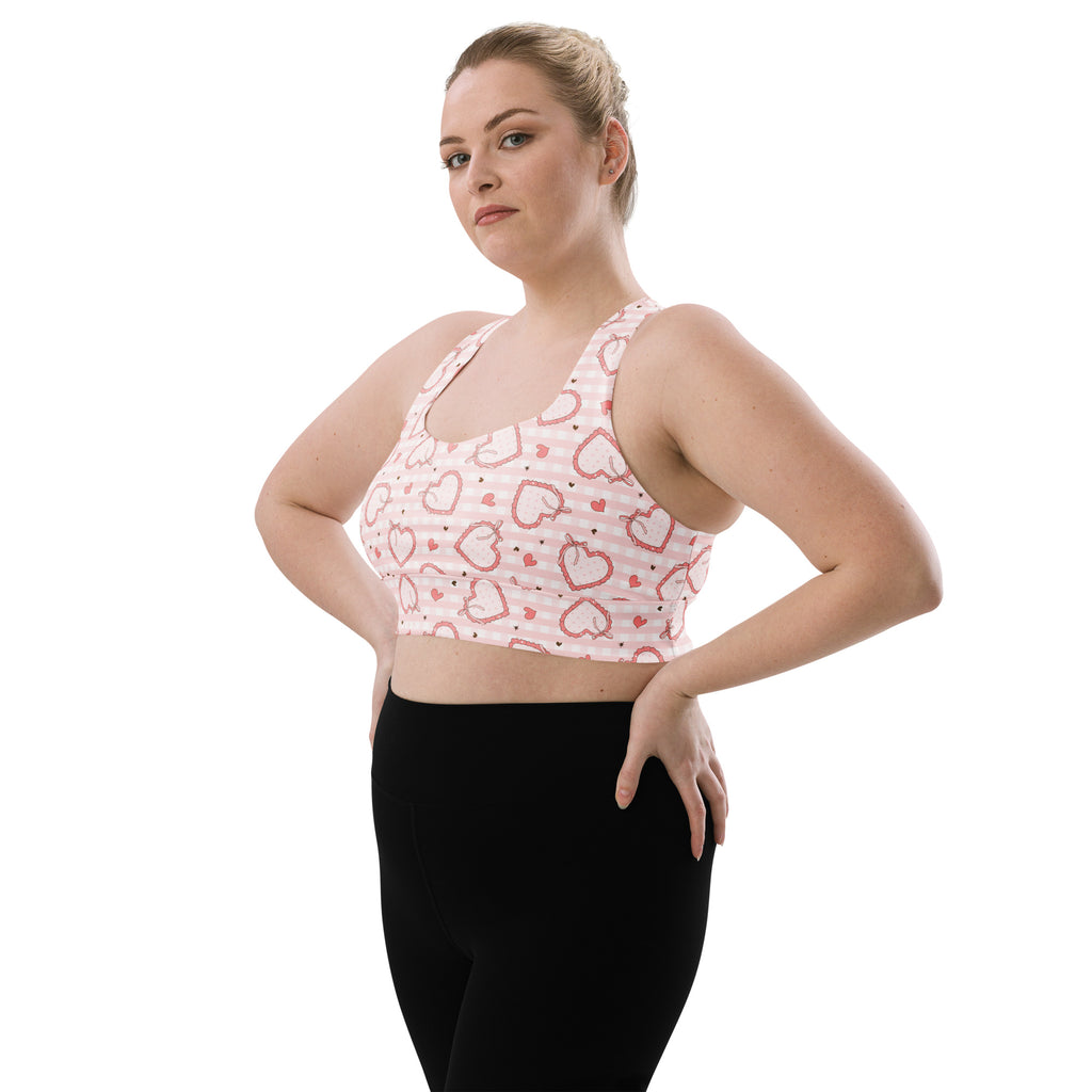 Women’s valentine’s day pink heart-patterned buttery soft recycled sports bra with thin straps and high intensity support
