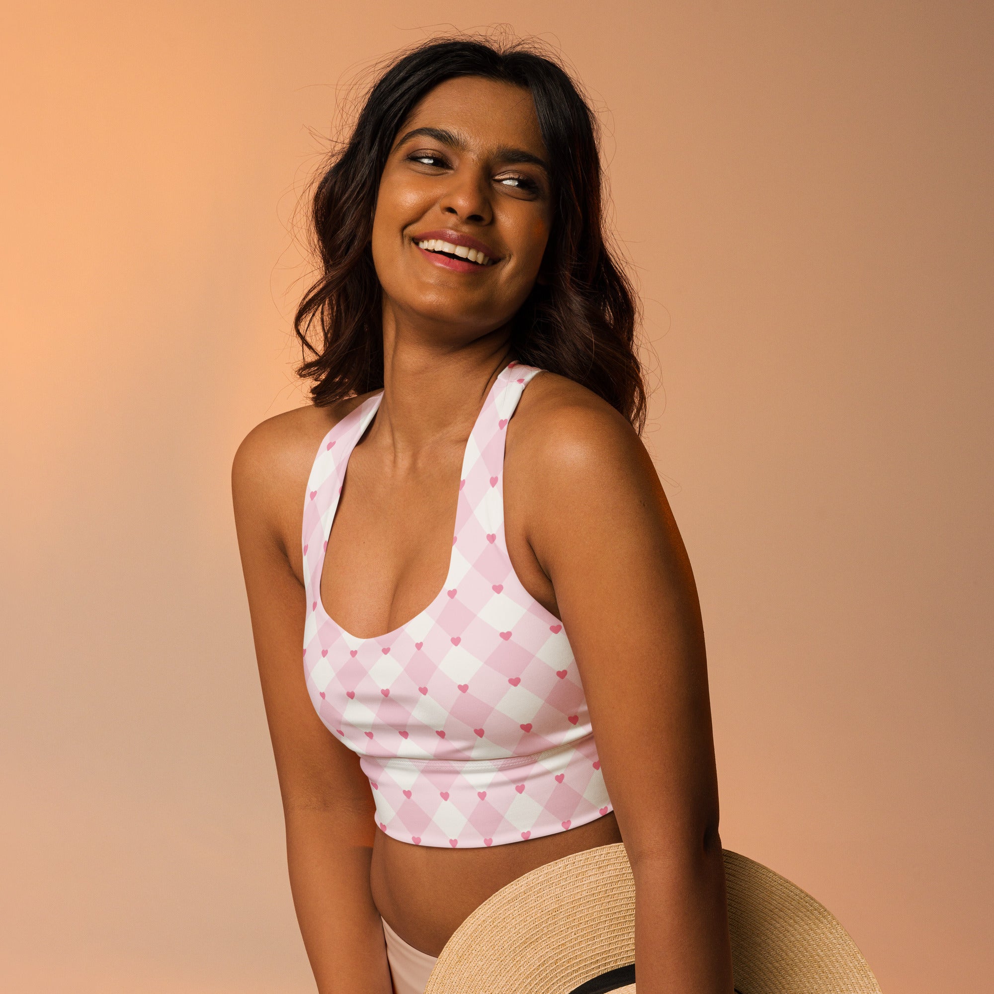 Women’s valentine’s day pink and white argyle heart buttery soft recycled longline sports bra front view