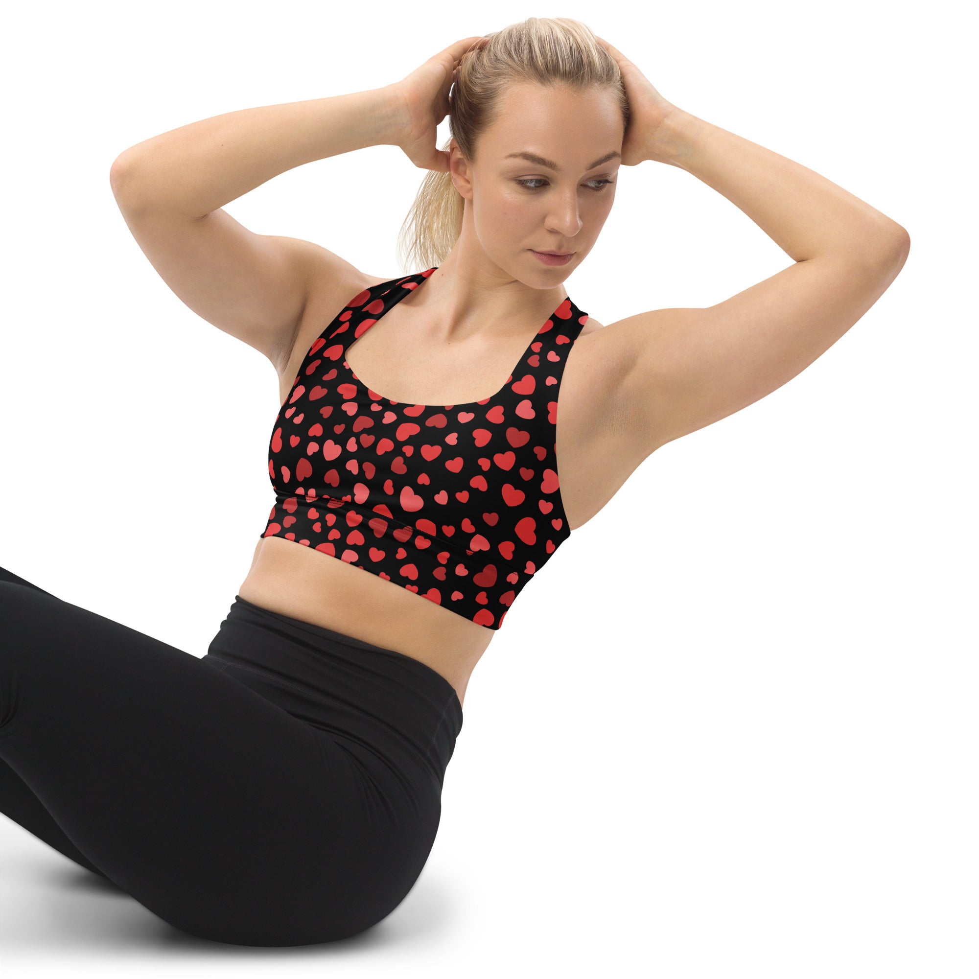 Black women’s longline sports bra with red heart pattern buttery soft recycled fabric high intensity support