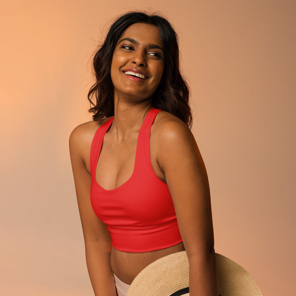 Red recycled longline sports bra in buttery soft fabric with halter neck and high intensity support for women