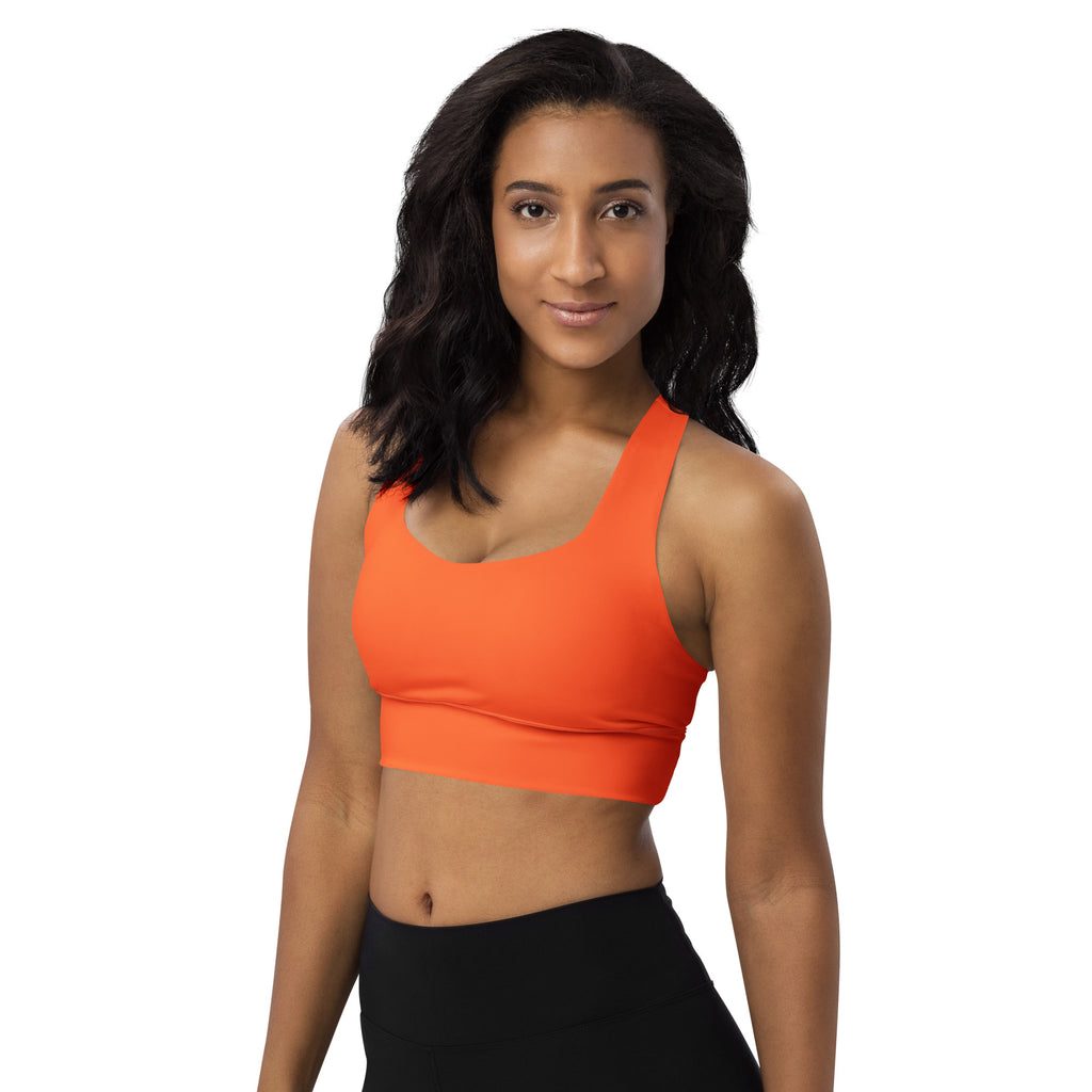Bright orange womens recycled longline sports bra with seamless racerback design high intensity support and quick dry