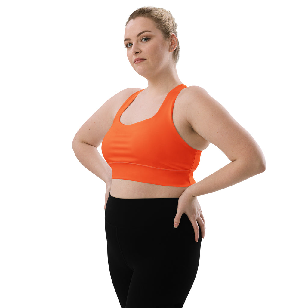 Bright orange womens buttery soft recycled sports bra with racerback seamless design for high intensity support