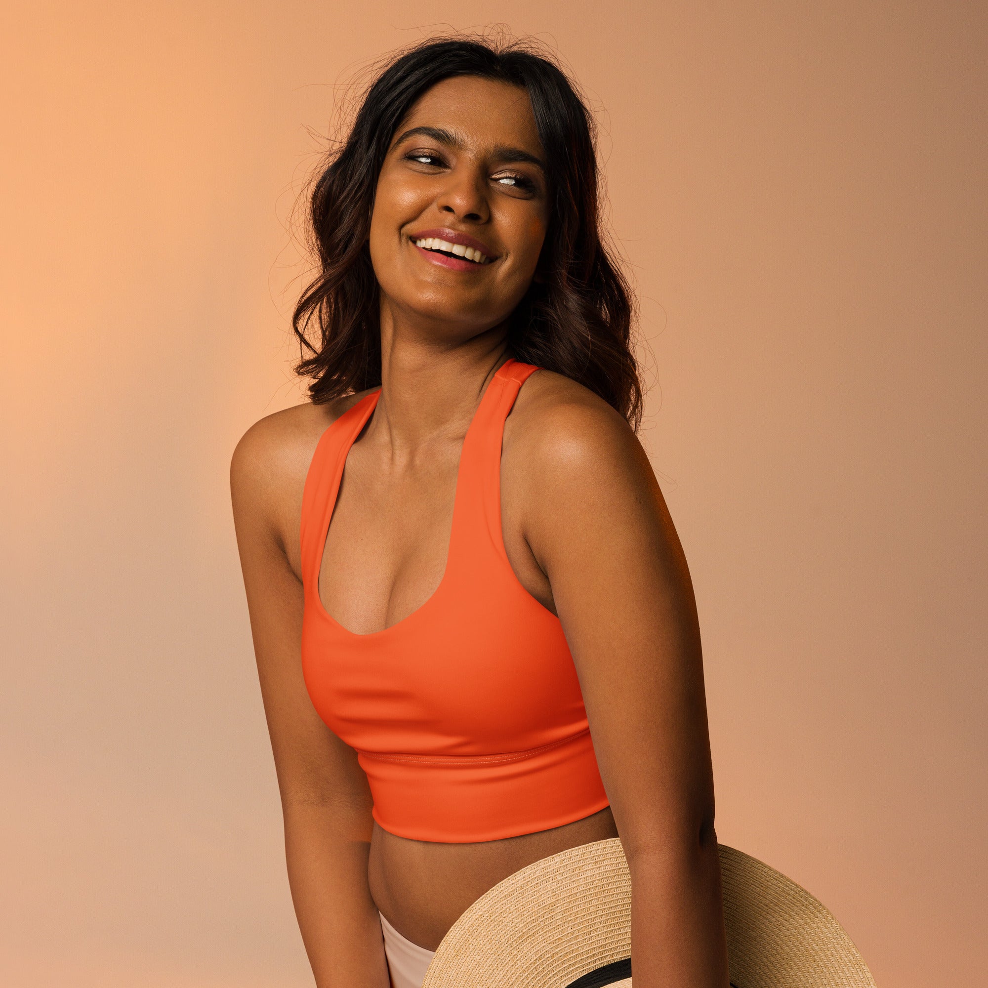 Women’s buttery soft orange recycled longline sports bra with halter neck for high intensity support and quick dry