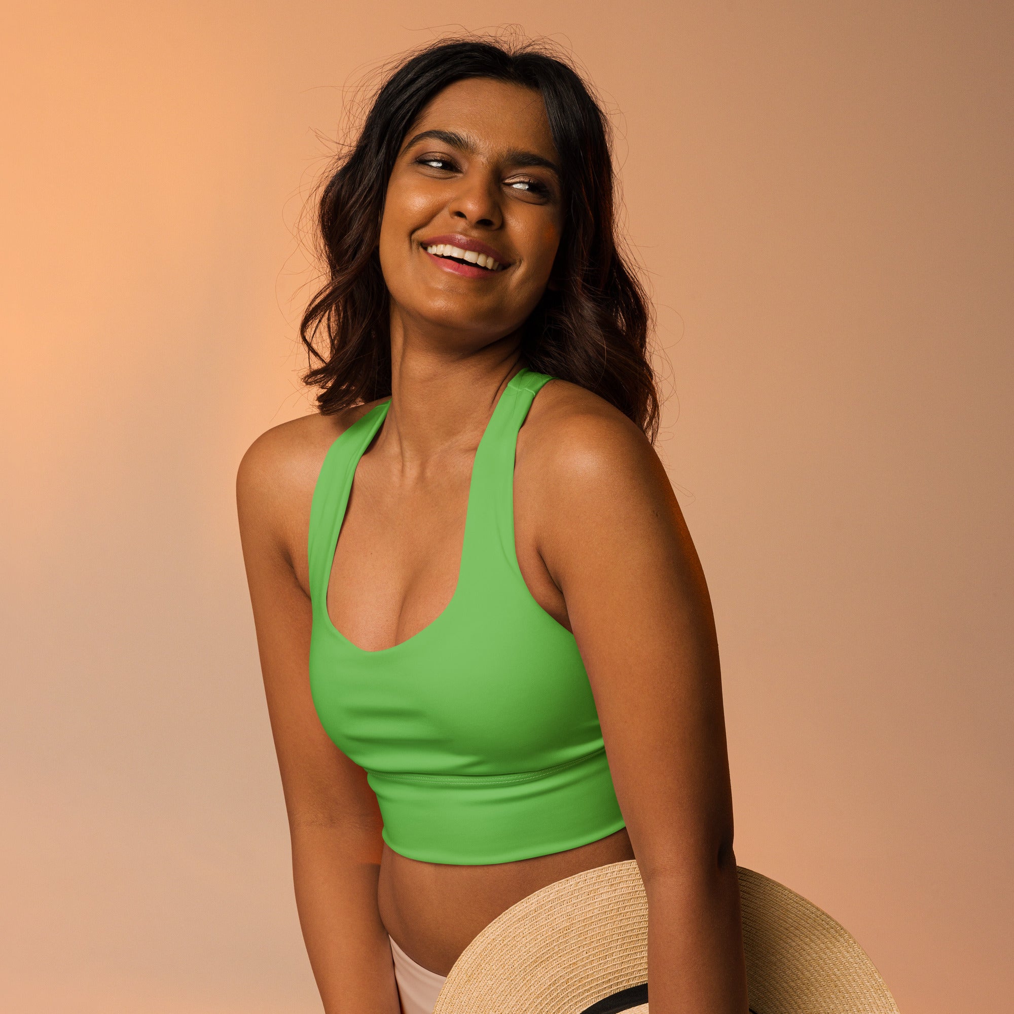 Bright green recycled longline sports bra with thin straps and rounded neckline for high intensity support