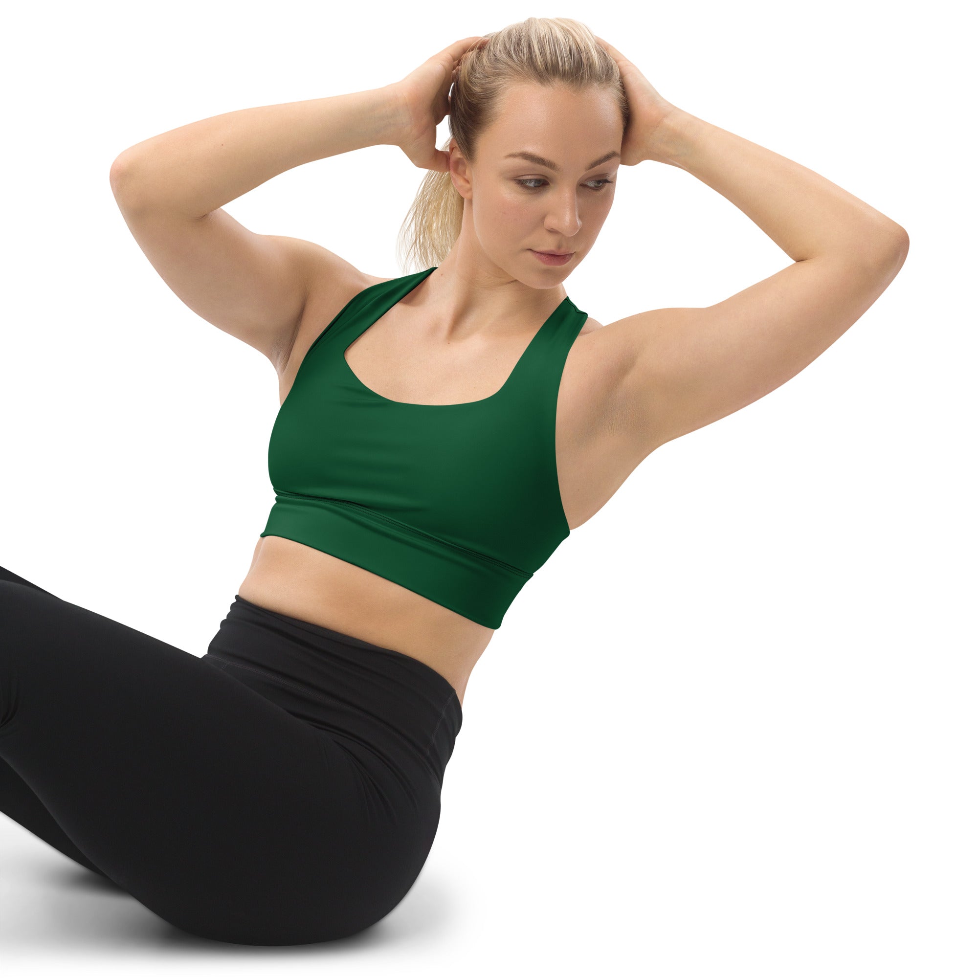 Green seamless longline sports bra with racerback design made from recycled material for high intensity support