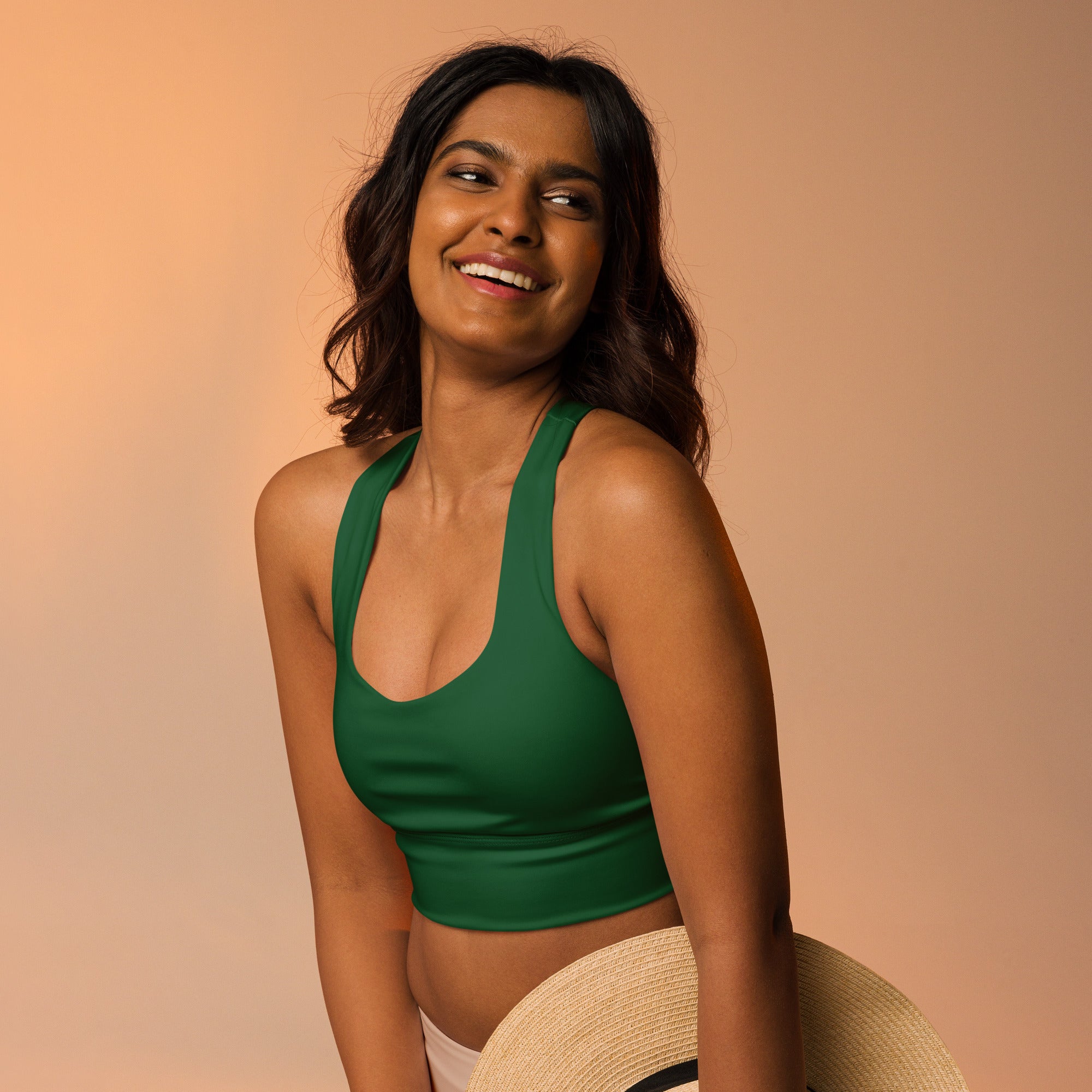 Green halter neck crop top made from buttery soft recycled fabric with high intensity support and upf 50 protection