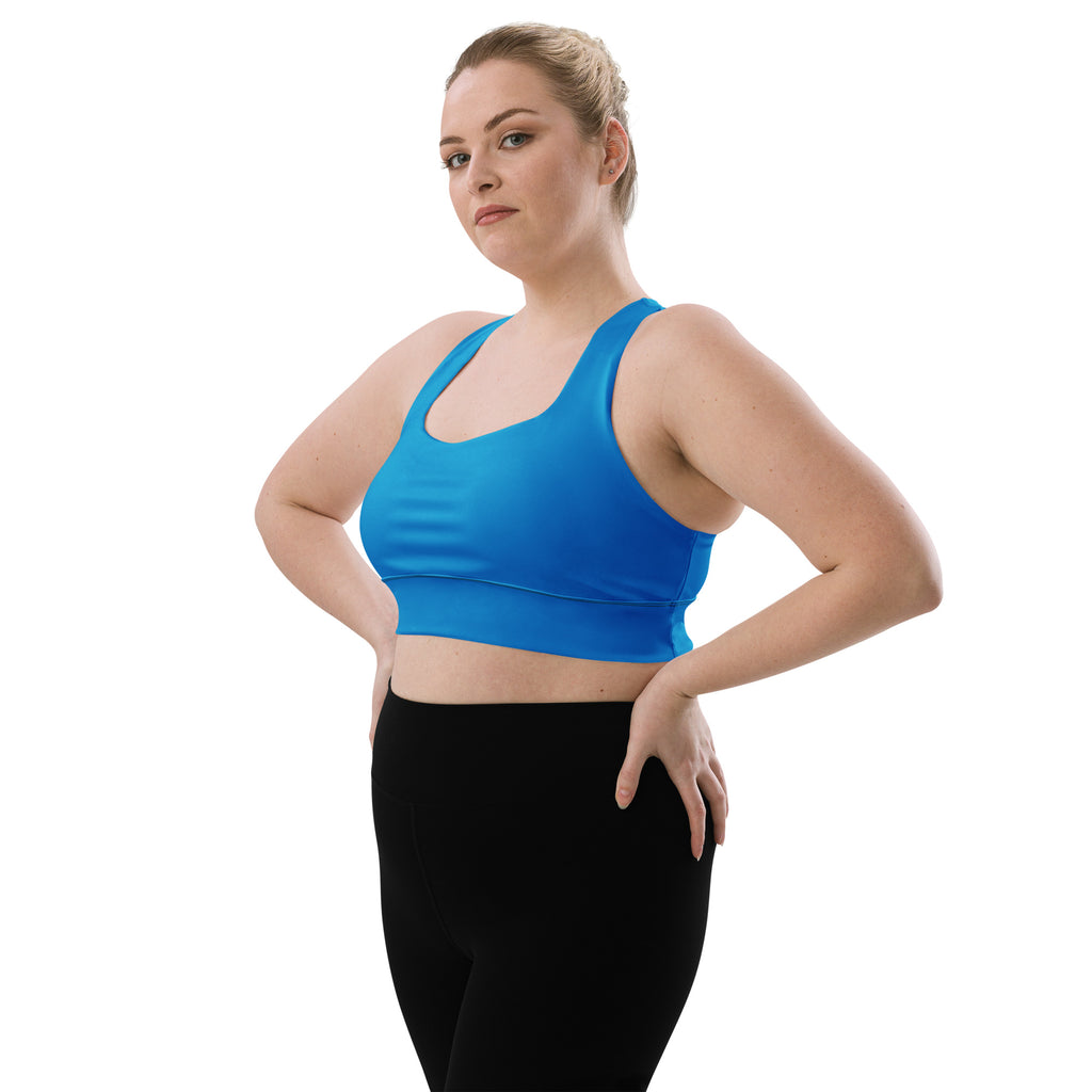 Bright blue seamless womens recycled longline sports bra with wide straps supportive band for high intensity support