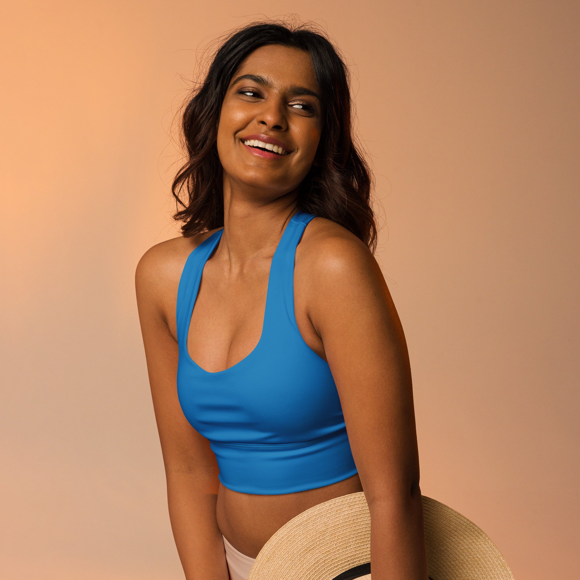 Vibrant blue halter-neck crop top with buttery soft recycled fabric for high intensity support and quick dry features