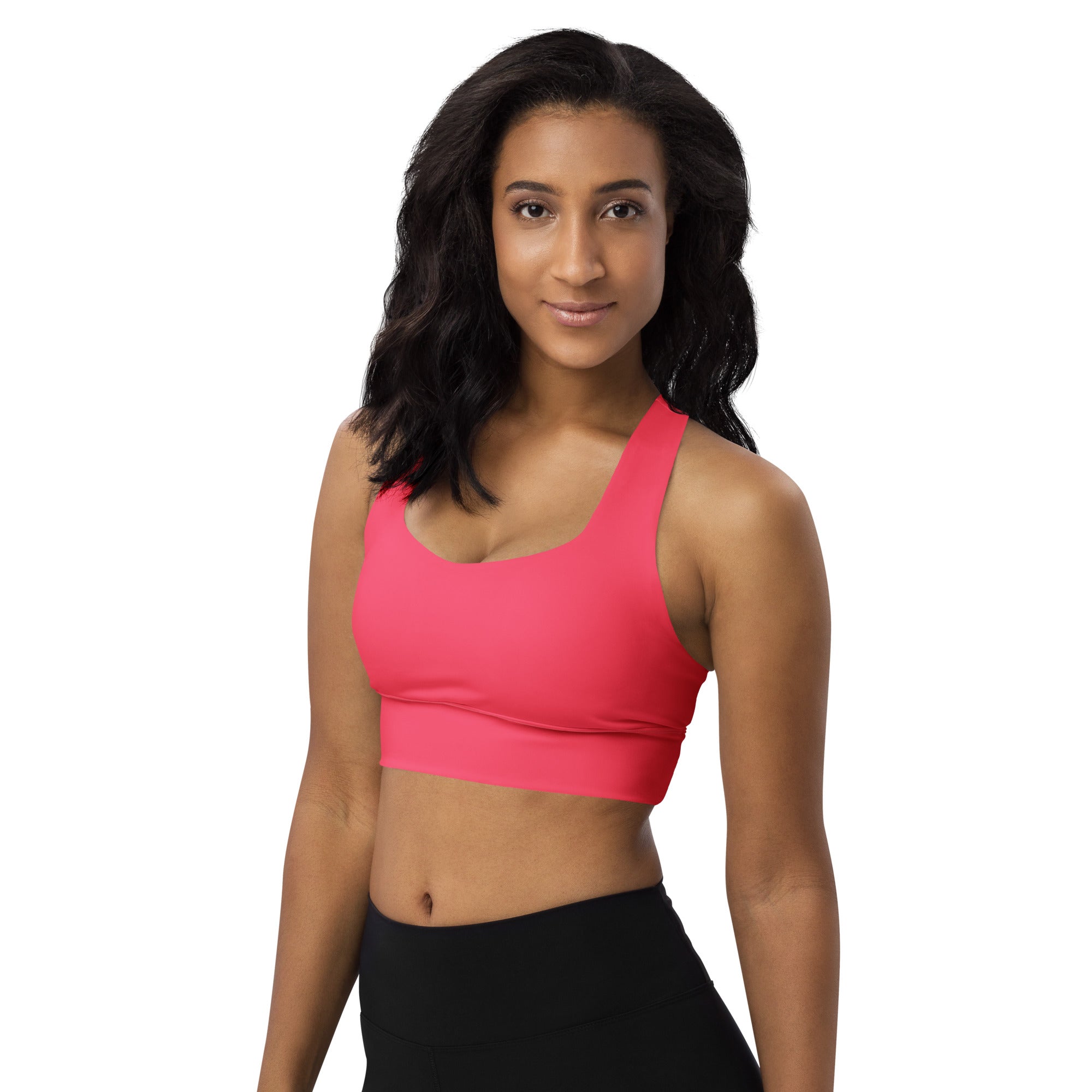 Bright pink seamless recycled longline sports bra with racerback straps and supportive band for high intensity support
