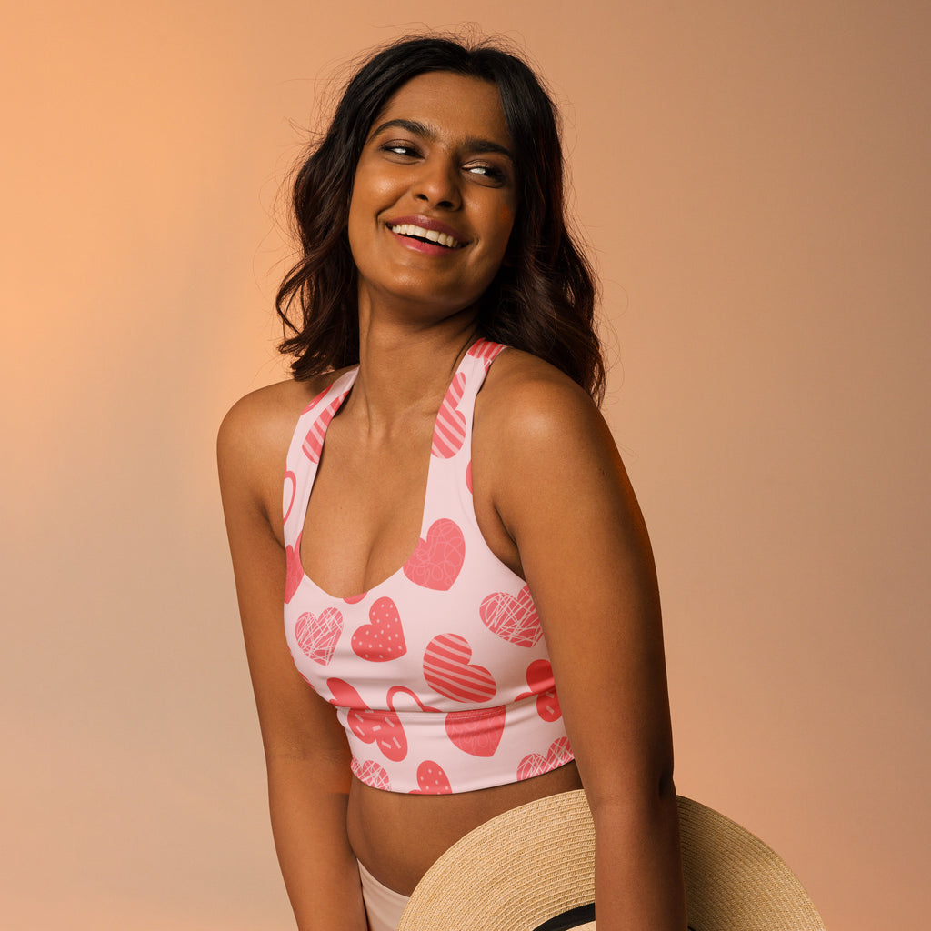 Women’s pink heart pattern buttery soft recycled crop top with halter neck and racerback straps for high support
