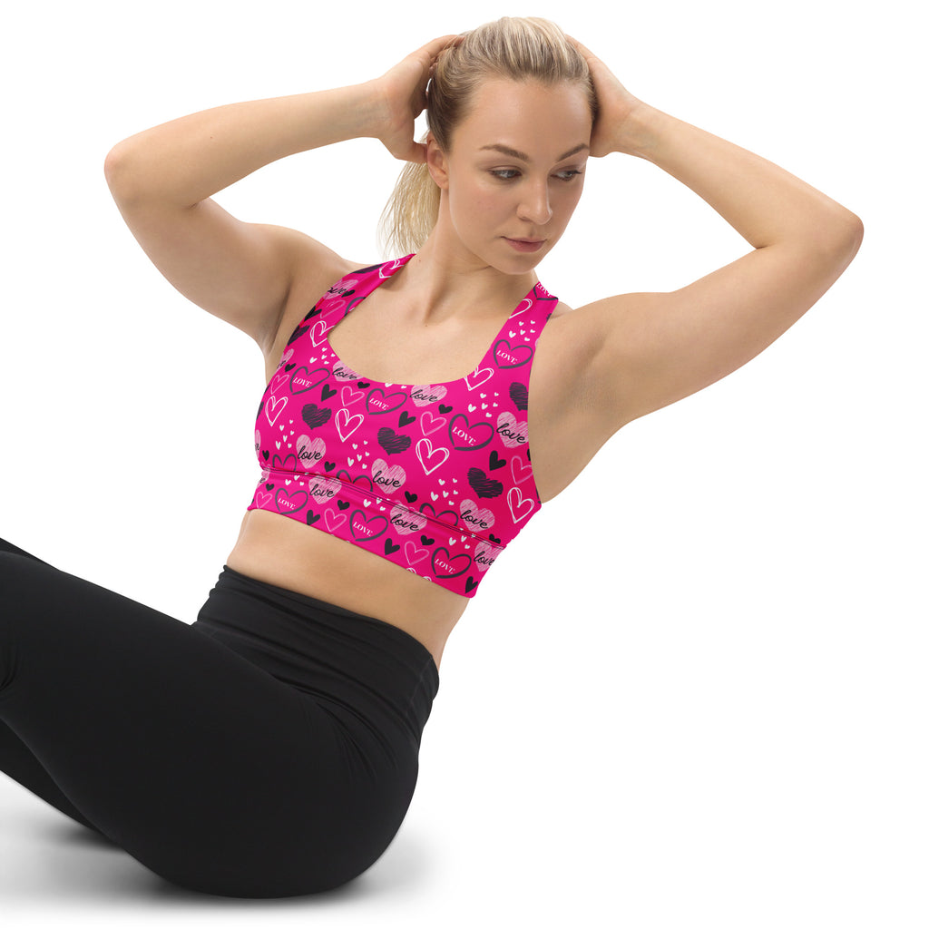 Women’s vibrant pink love heart longline sports bra with buttery soft recycled fabric for high intensity support