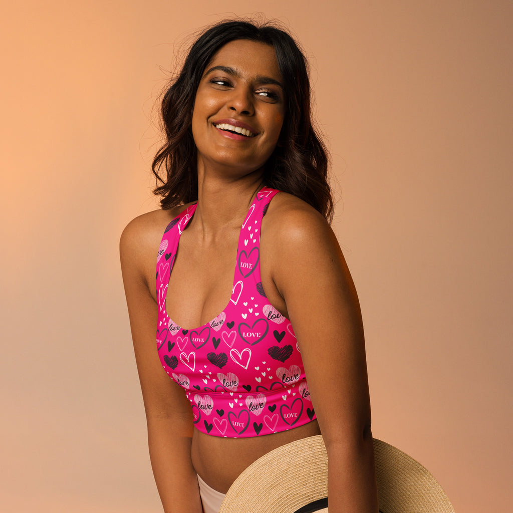 Women’s pink longline sports bra with black heart and love print buttery soft recycled fabric high intensity support
