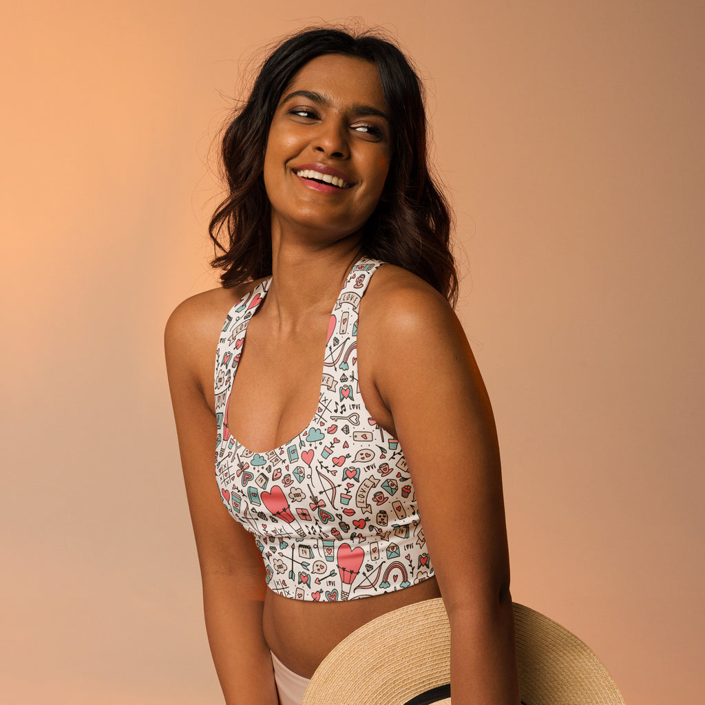 Women’s white doodle heart longline sports bra with pink teal black pattern high intensity support and upf 50 plus