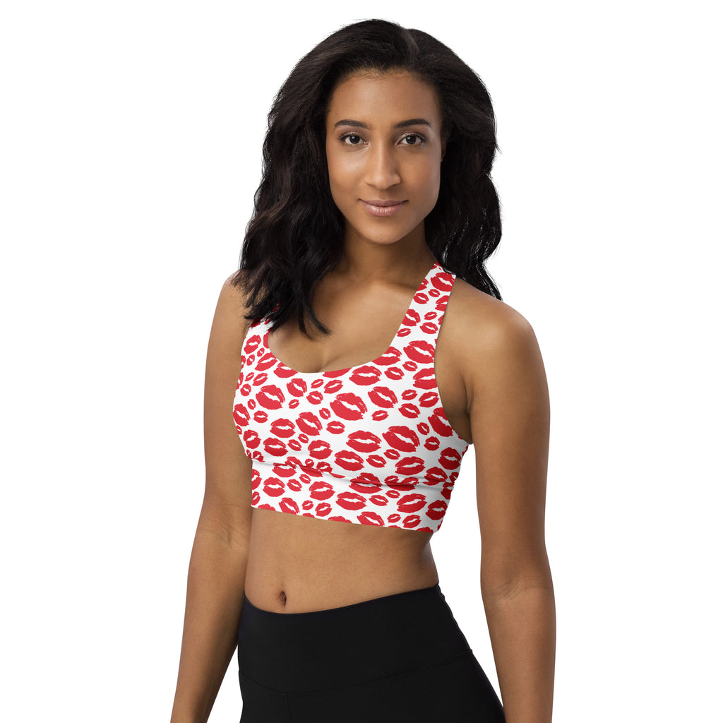 White longline sports bra with vibrant red lipstick print made from buttery soft recycled fabric for high intensity support