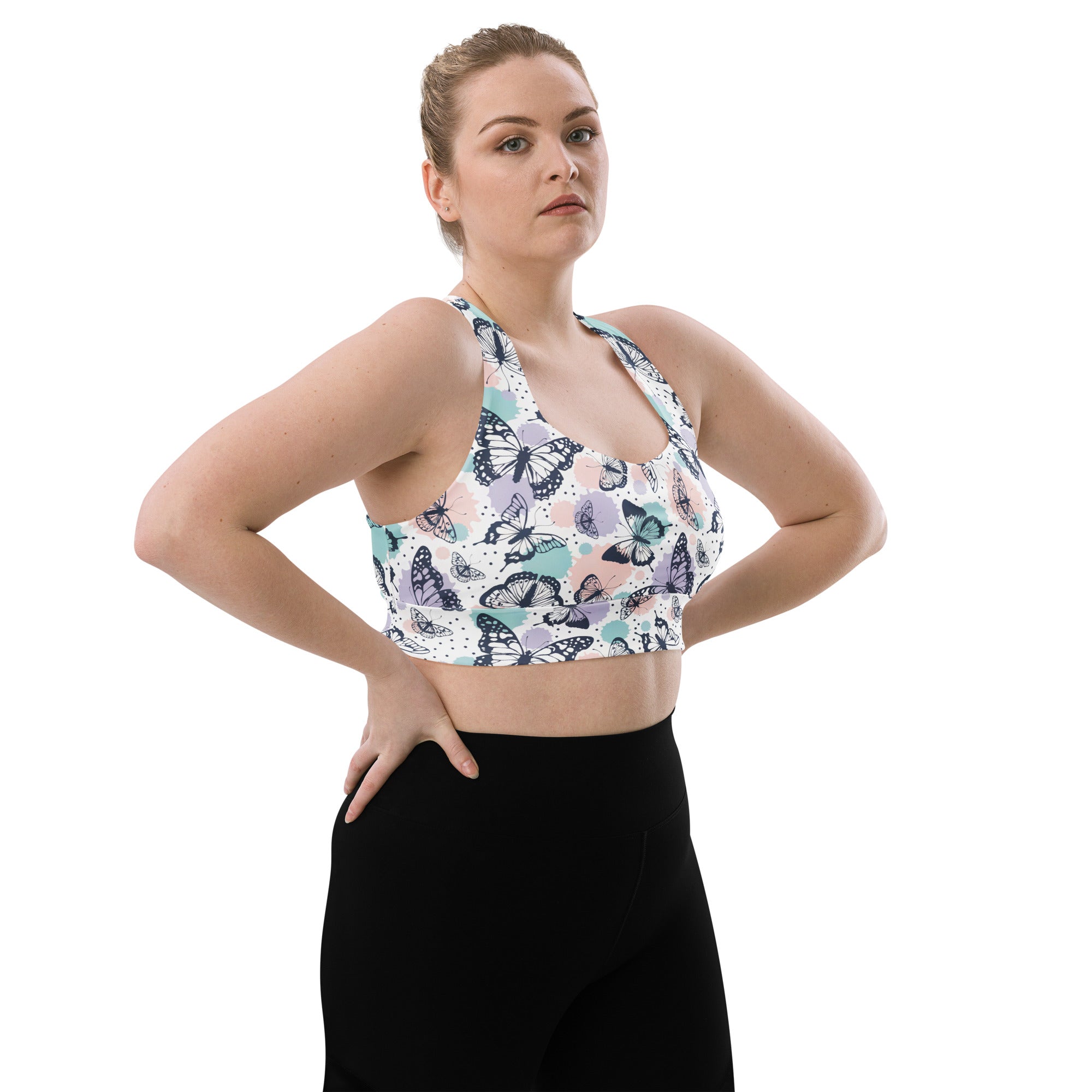 Women’s butterflies buttery soft recycled longline sports bra with vibrant black teal pink butterfly print on white fabric