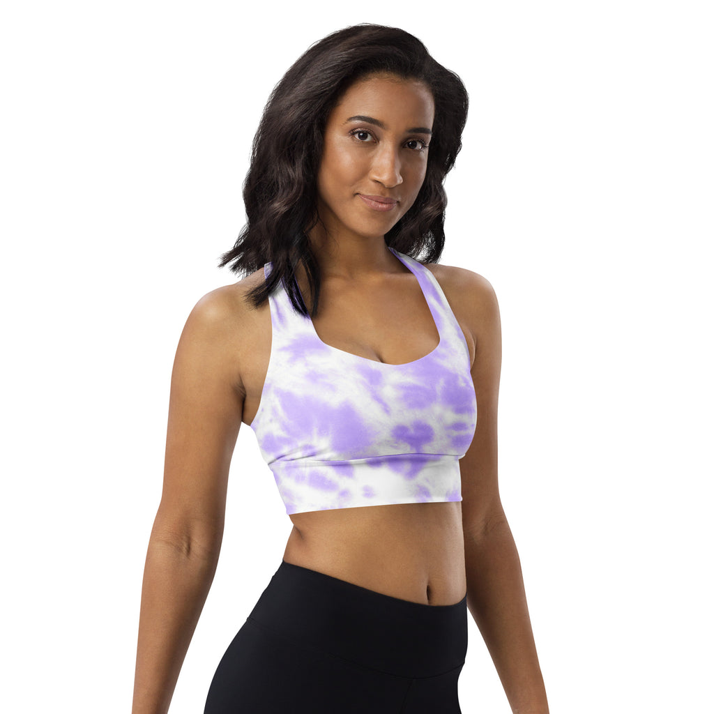 Woman wearing a lavender and white tie dye buttery soft recycled longline sports bra with halter neckline and upf 50+