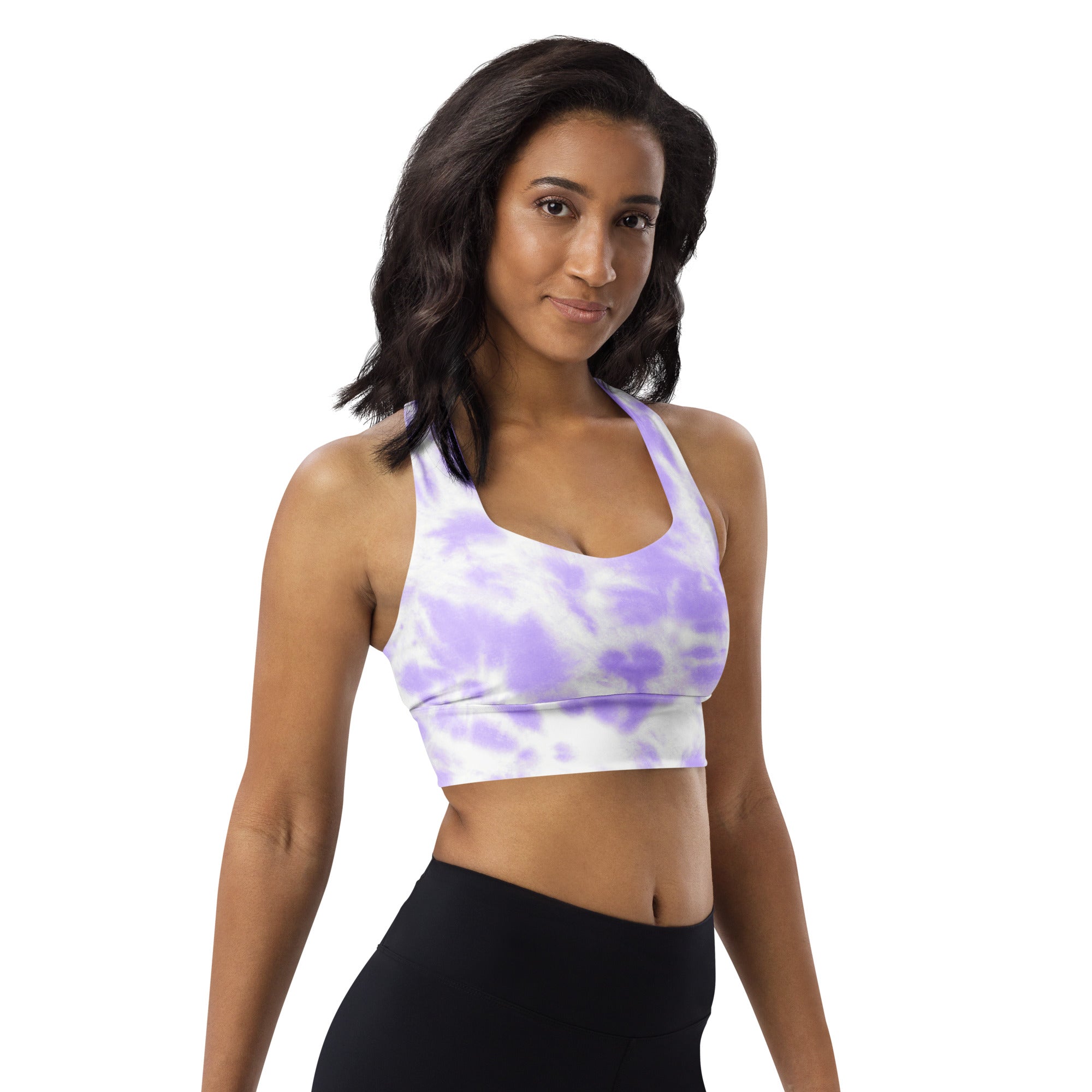 Woman wearing a lavender and white tie dye buttery soft recycled longline sports bra with halter neckline and upf 50+