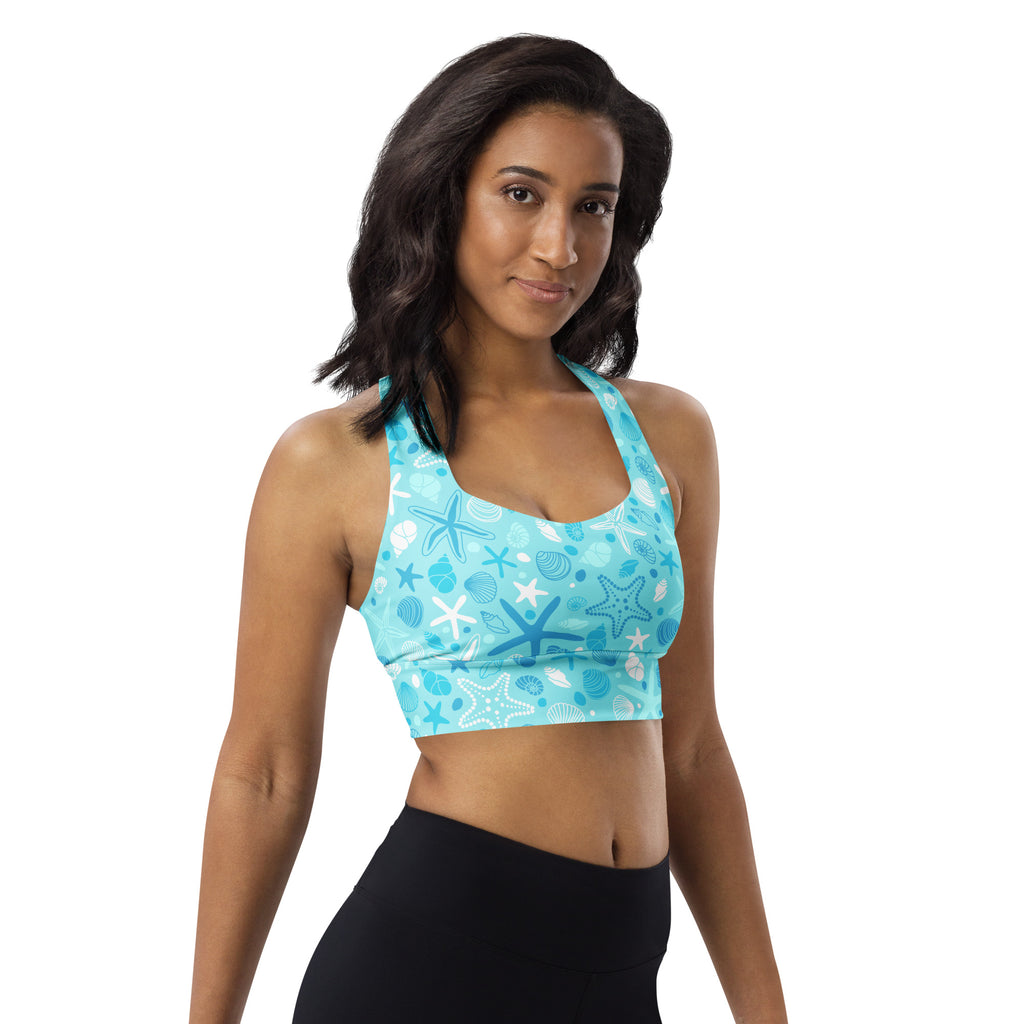 A light blue women’s starfish and shells longline sports bra with buttery soft recycled fabric for high intensity support