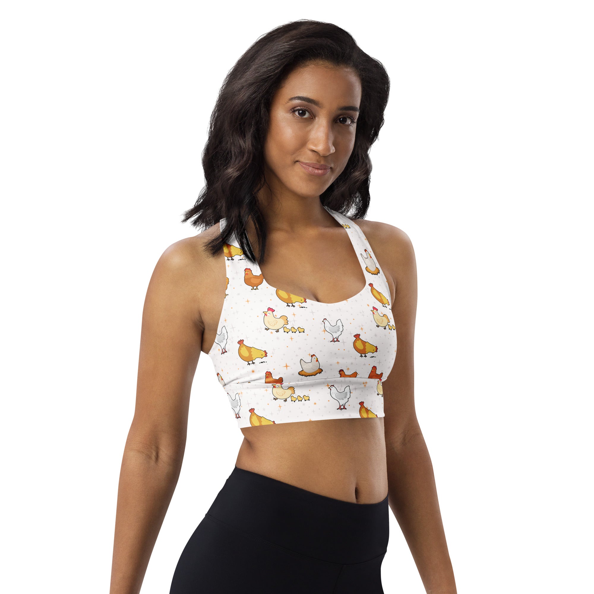 White recycled longline sports bra with playful yellow orange chicken pattern for high intensity support and quick dry