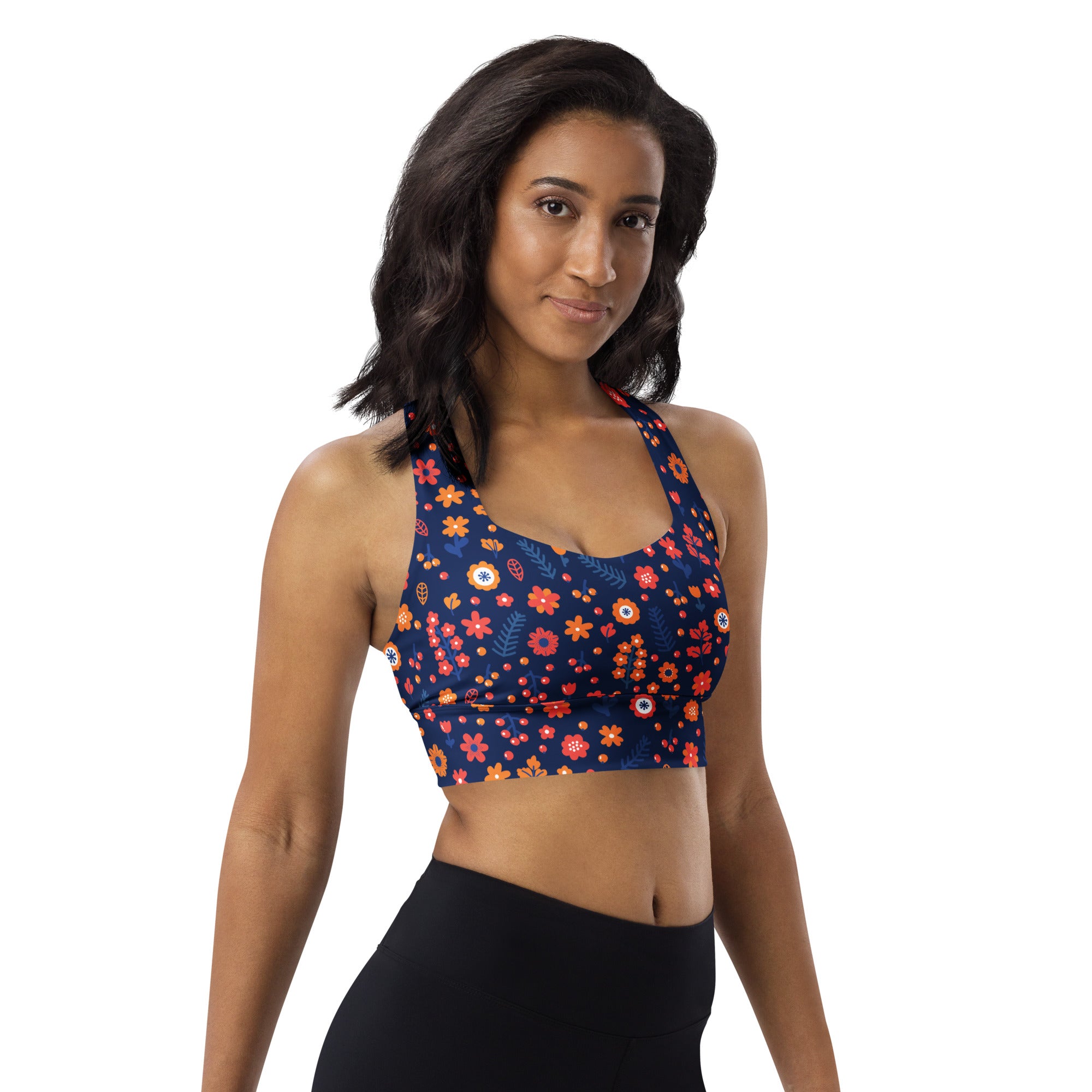 Women’s navy blue recycled longline sports bra with vibrant orange pink yellow floral pattern high intensity support