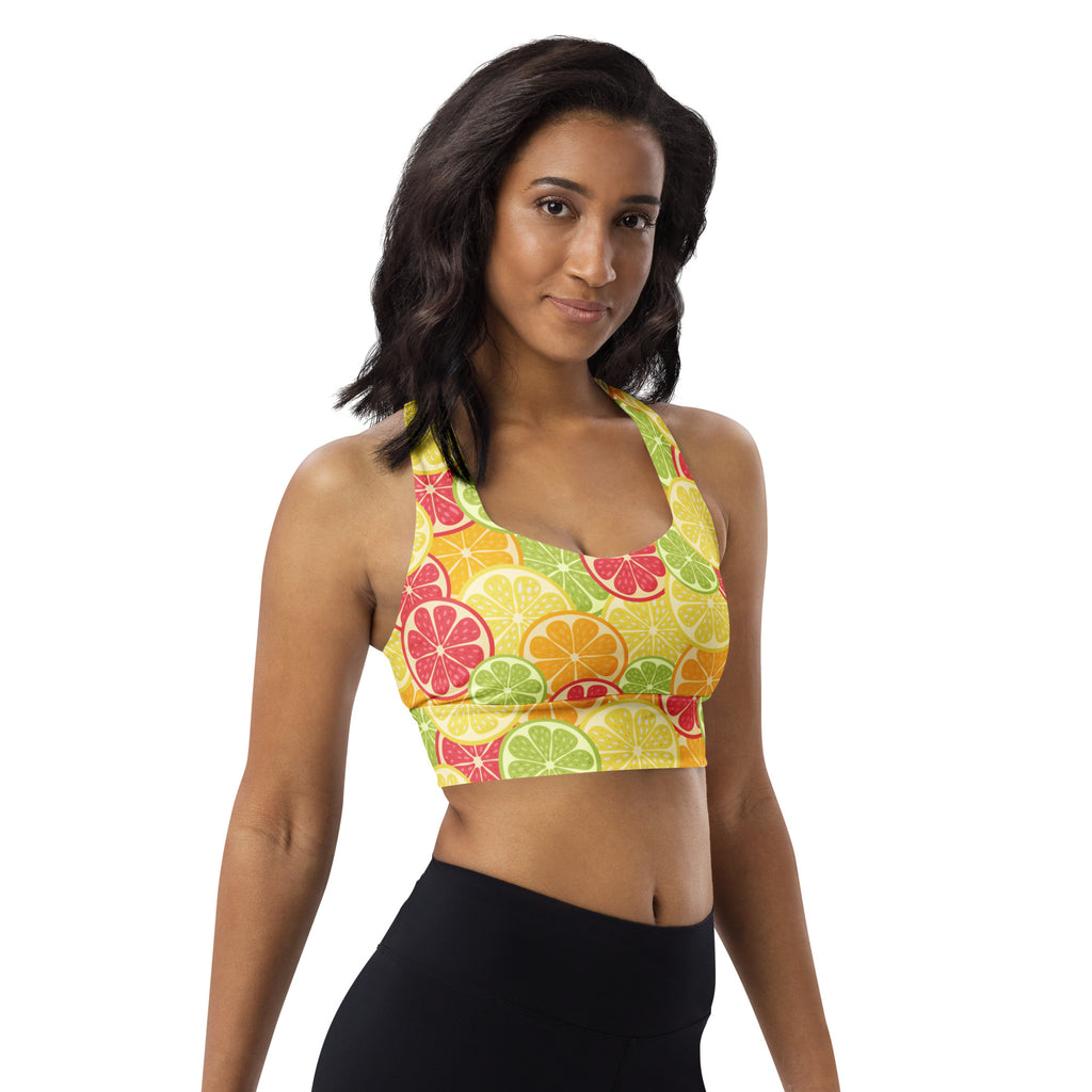 A vibrant yellow women’s citrus slice buttery soft recycled longline sports bra with high intensity support and removable padding