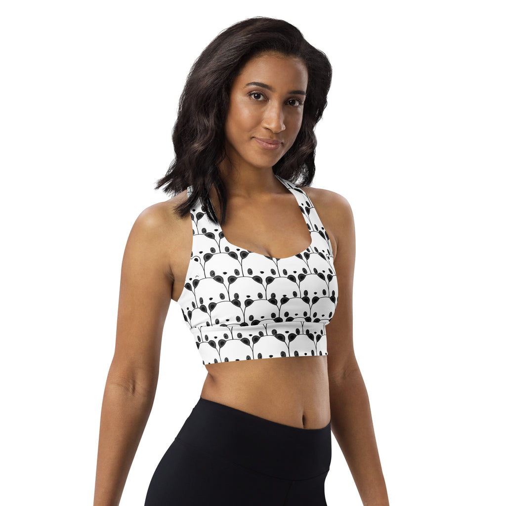 White buttery soft recycled longline sports bra with playful black panda face pattern for high intensity support