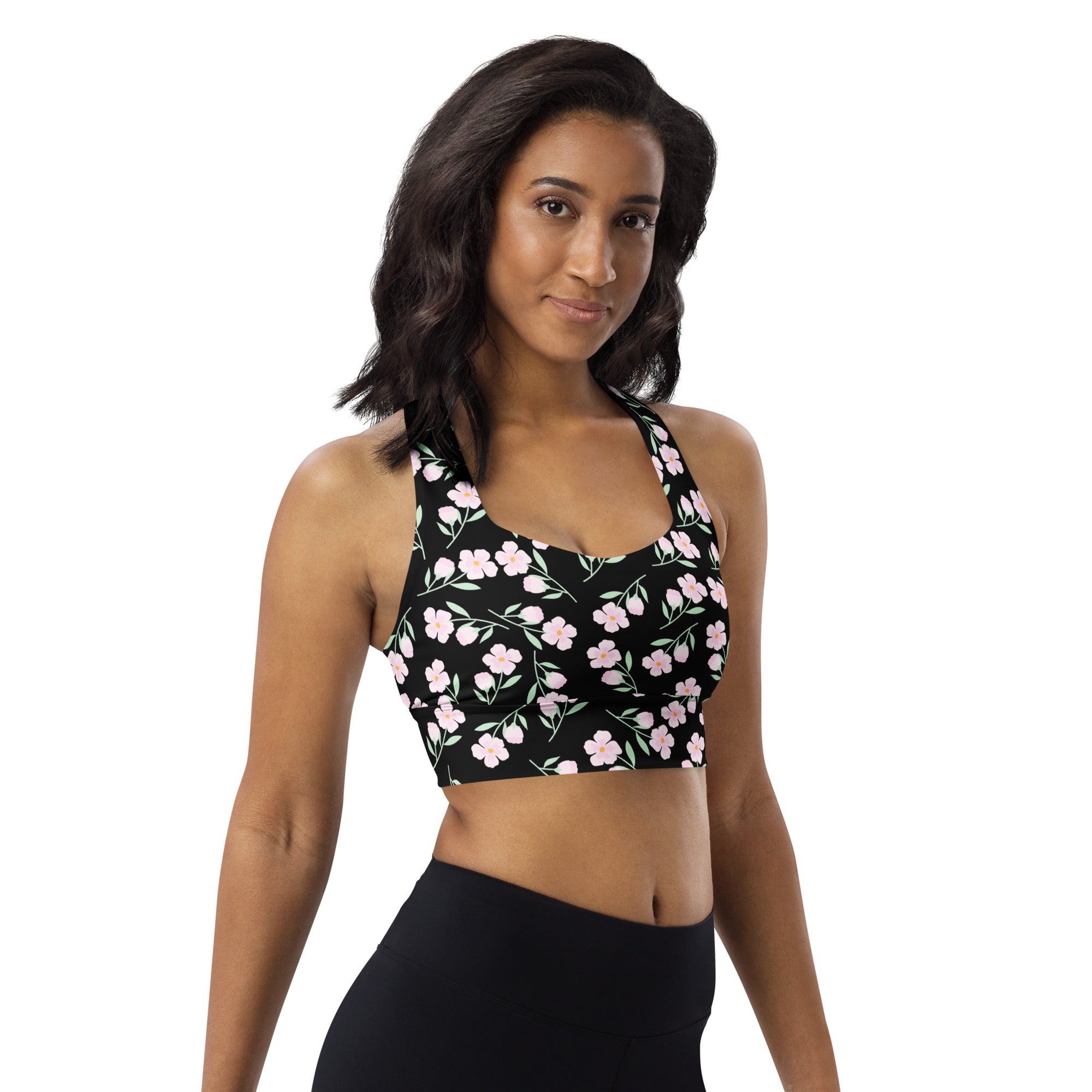 Women’s black floral print longline sports bra with delicate pink pattern, buttery soft recycled fabric, high intensity support