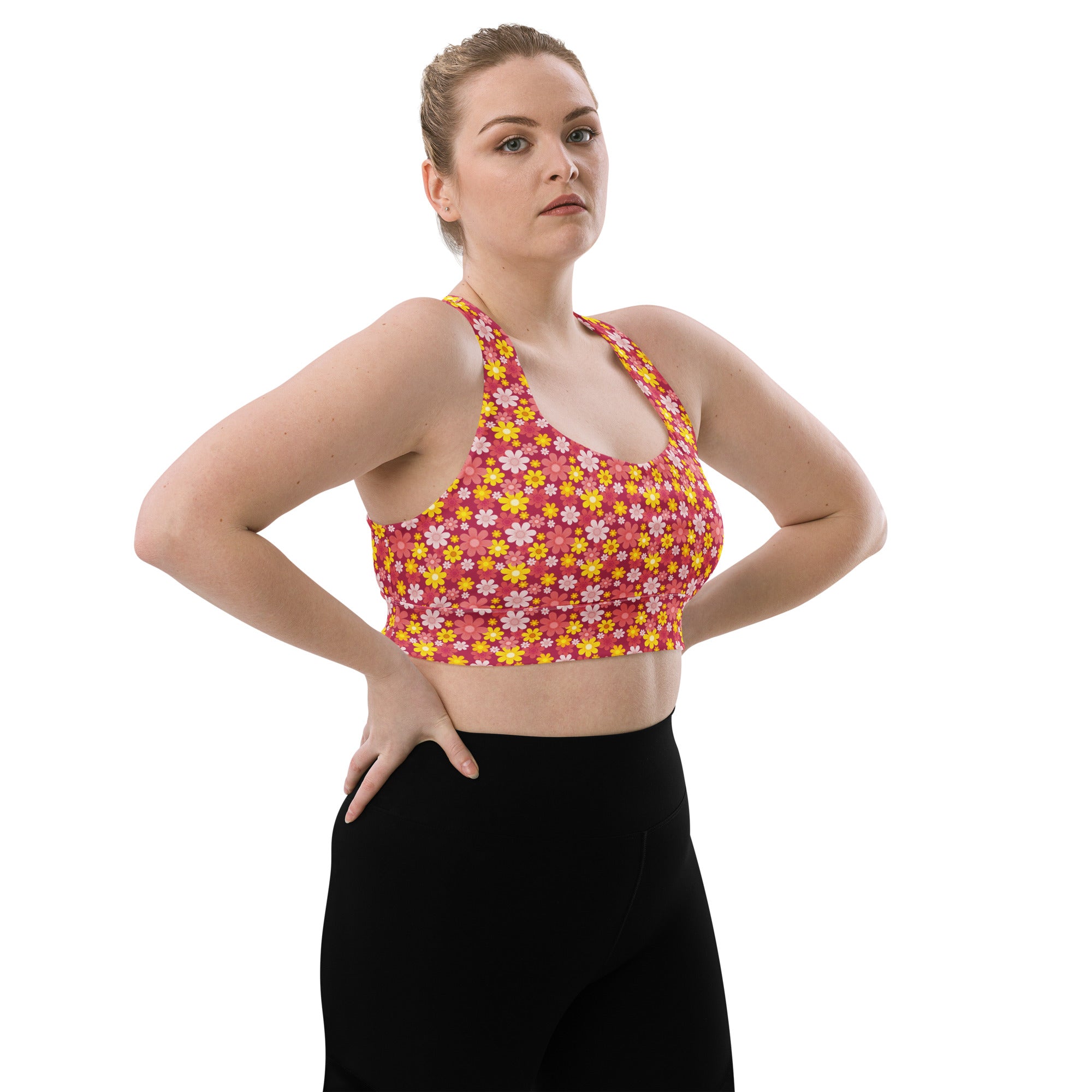 Women’s buttery soft recycled longline sports bra in vibrant pink and yellow floral print with adjustable straps