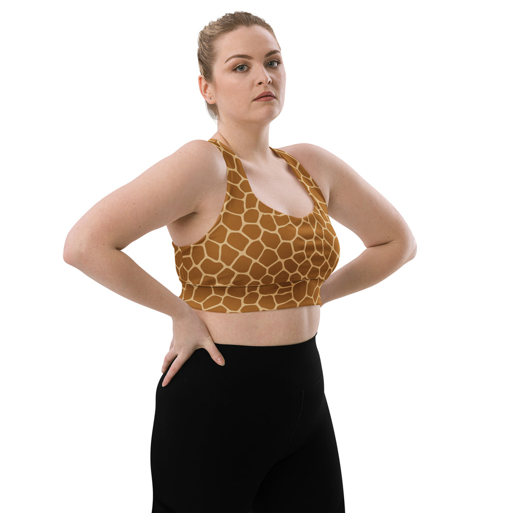 Women’s longline sports bra with vibrant giraffe print and tan brown geometric patterns made from stretchy recycled fabric