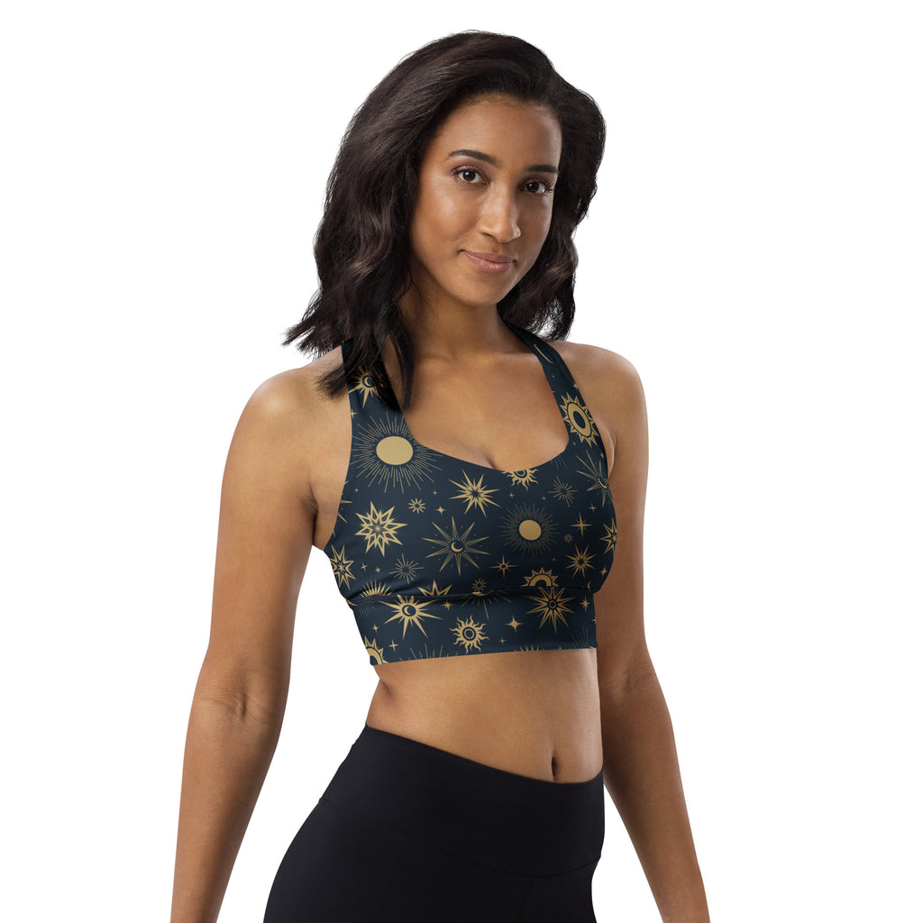 Dark blue longline sports bra with celestial gold suns moons and stars pattern high intensity support buttery soft recycled fabric