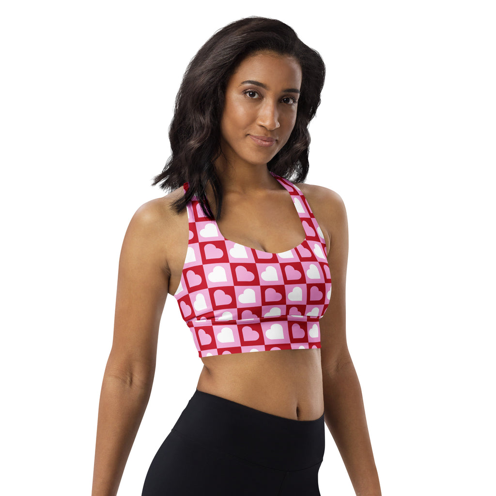 Women’s pink and white heart print buttery soft recycled longline sports bra with checkered design for high intensity support