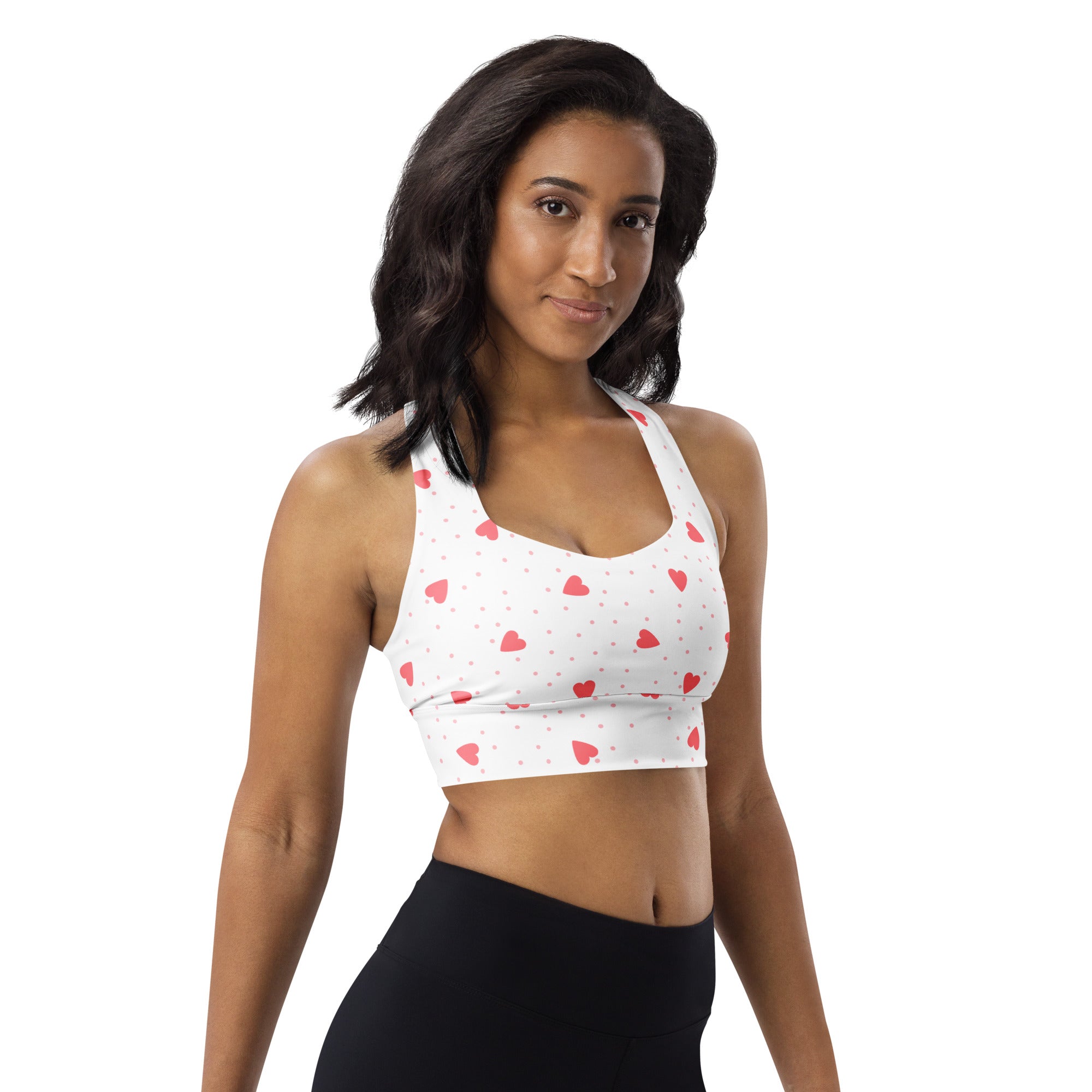 White longline sports bra with pink heart and dot pattern buttery soft recycled fabric high intensity support