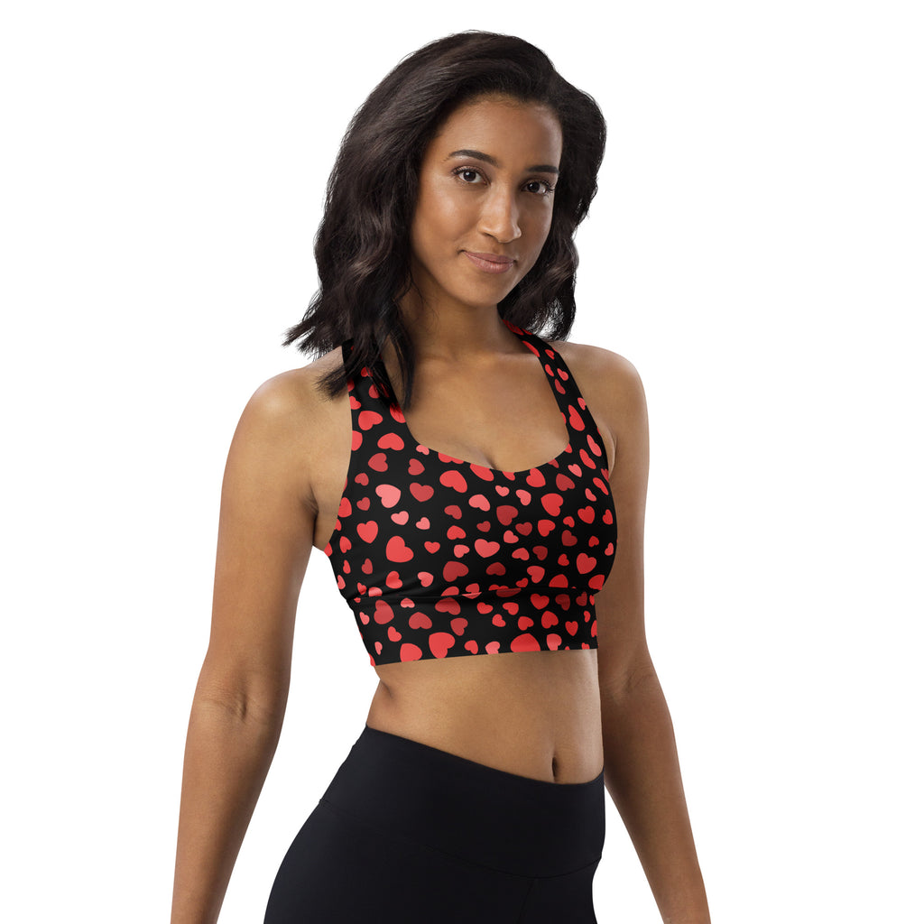 Women’s black sports bra with red heart pattern buttery soft recycled fabric high intensity support and upf 50+